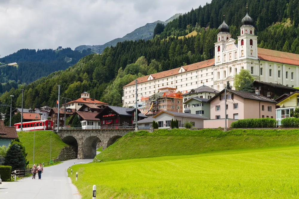 DISENTIS -MUSTER, SWITZERLAND - AUGUST 10: Benedictine monastery in the Swiss Alps, Disentis -Muster, Switzerland on August 10, 2014. The monastery was built between 1696 and 1712.