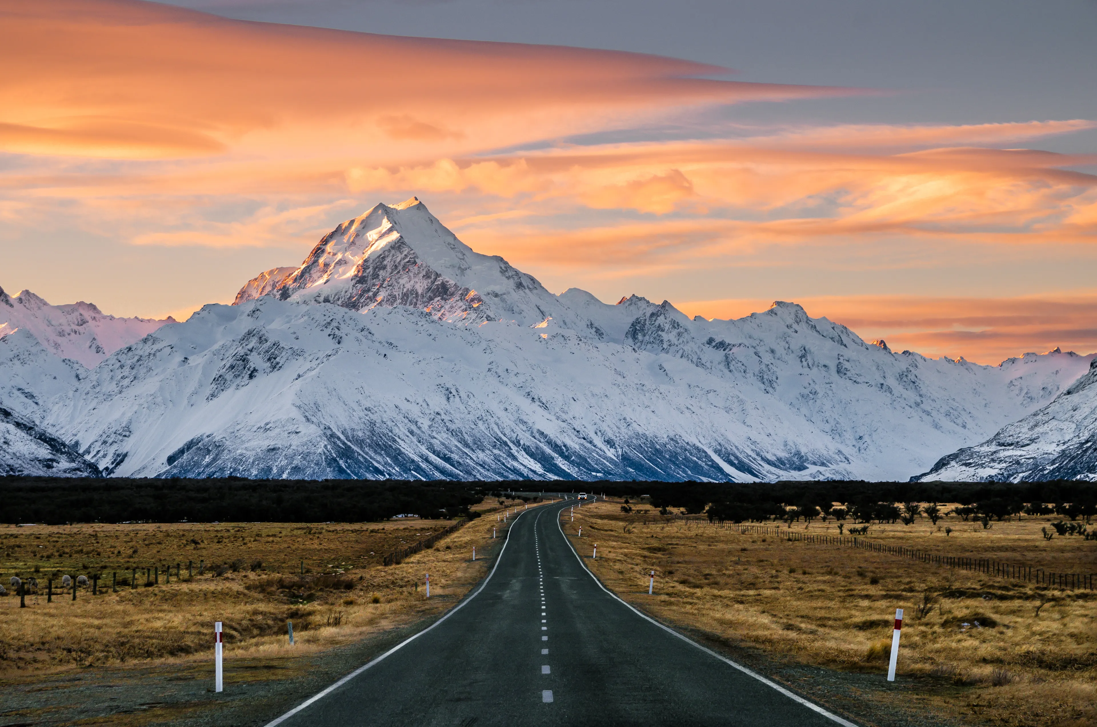 View of the majestic Aoraki Mount Cook with the road leading to Mount Cook Village. Taken during winter in New Zealand.