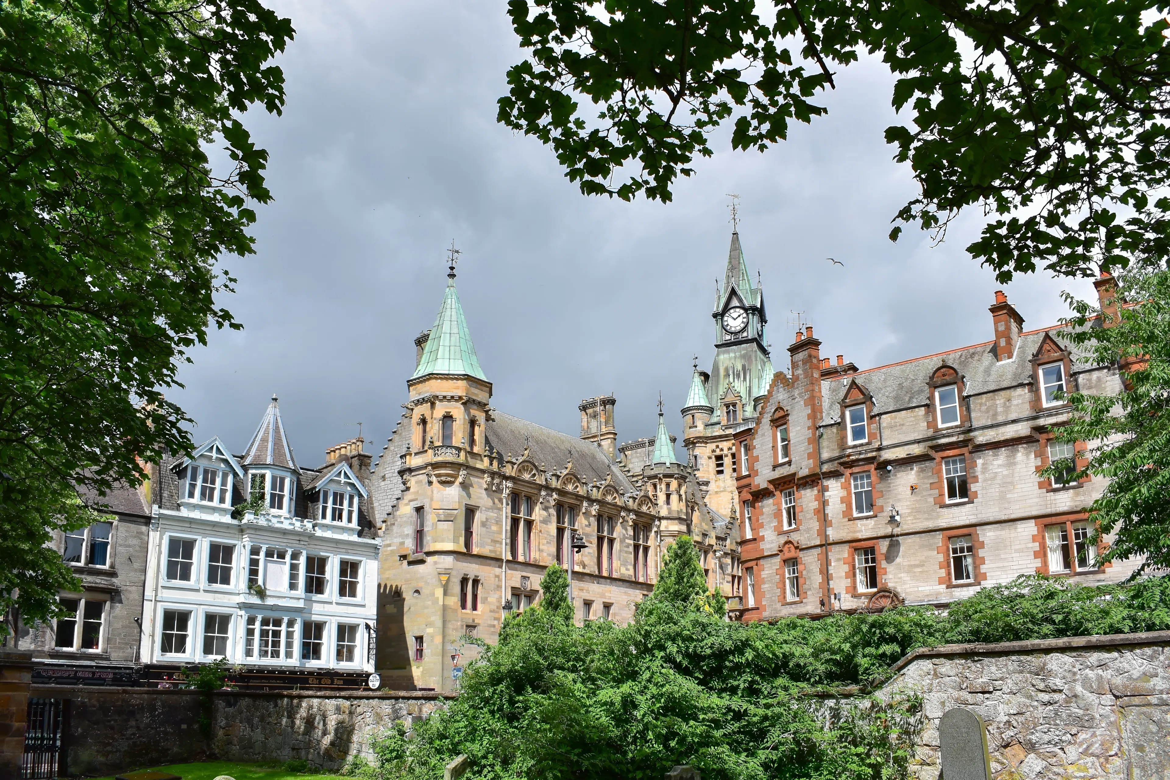 Dunfermline, United Kingdom - July 17, 2023: historical buildings and city chambers, view from Dunfermline Abbey churchyard. Scotland, Great Britain, travel Europe.