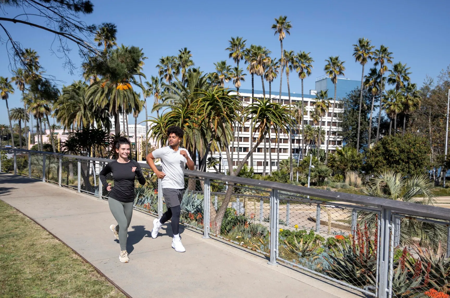 Young friends jogging together