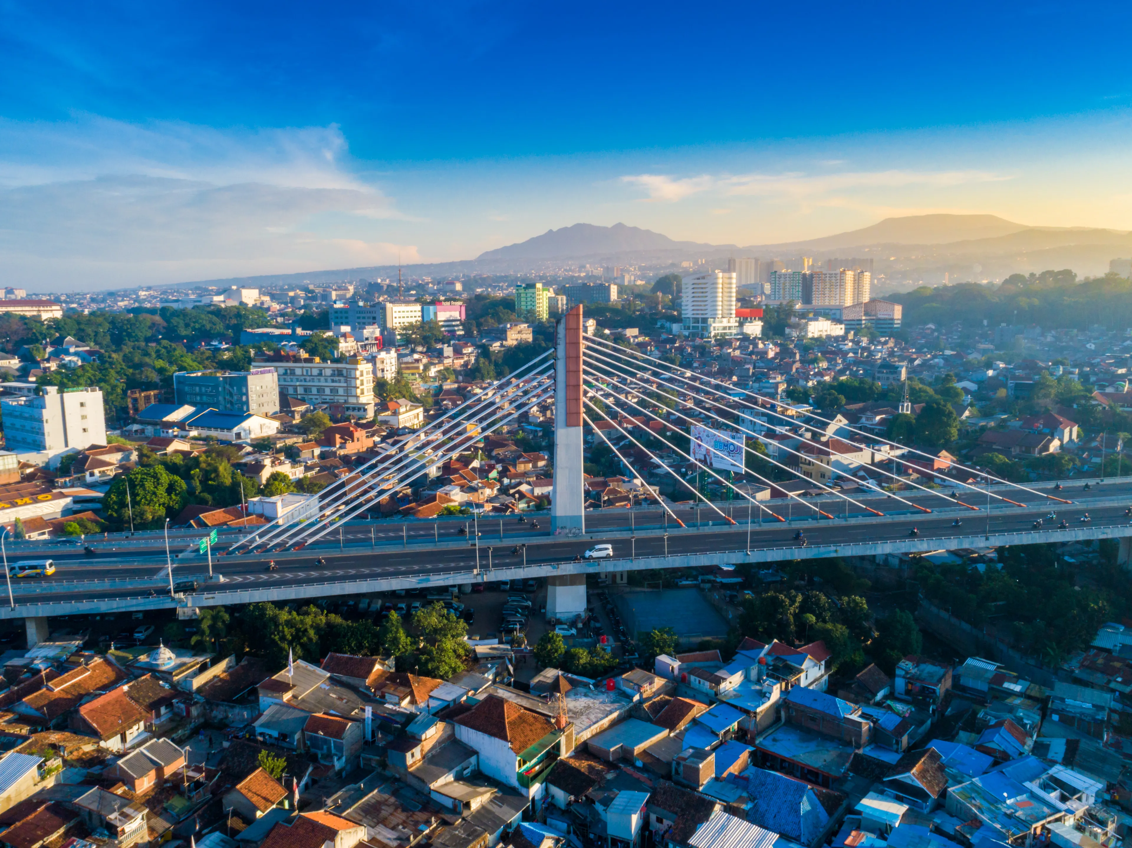 Bandung, West Java / Indonesia - June 23, 2018: Aerial View of Pasupati Suspension Bridge, the Longest Flyover and one icon of Bandung, with Mount Tangkuban Parahu in the Background
