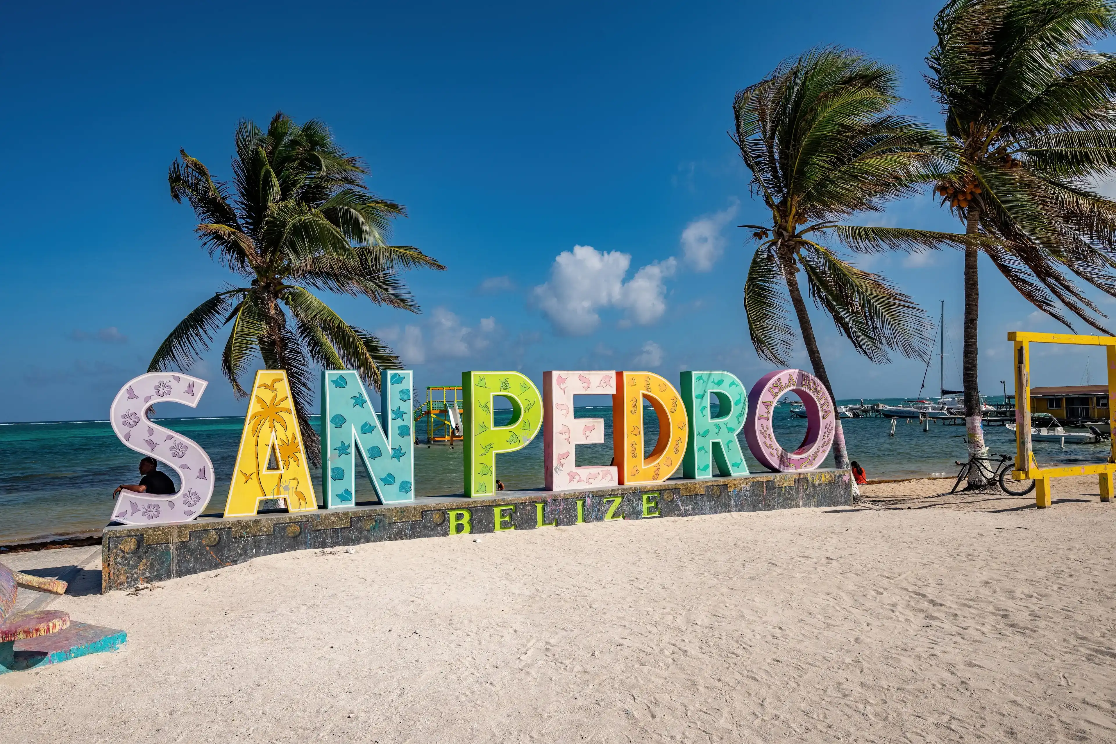 San Pedro, Ambergris Caye, Belize - April 2, 2023: Welcome to San Pedro sign at the foreshore Central Park in the main town on Ambergris Caye, the largest of Belize's inhabited offshore islands. San Pedro, Ambergris Caye, Belize - April 2, 2023: Welcome to San Pedro sign at the foreshore Central Park in the main town on Ambergris Caye, the largest of Belize's inhabited offshore islands.