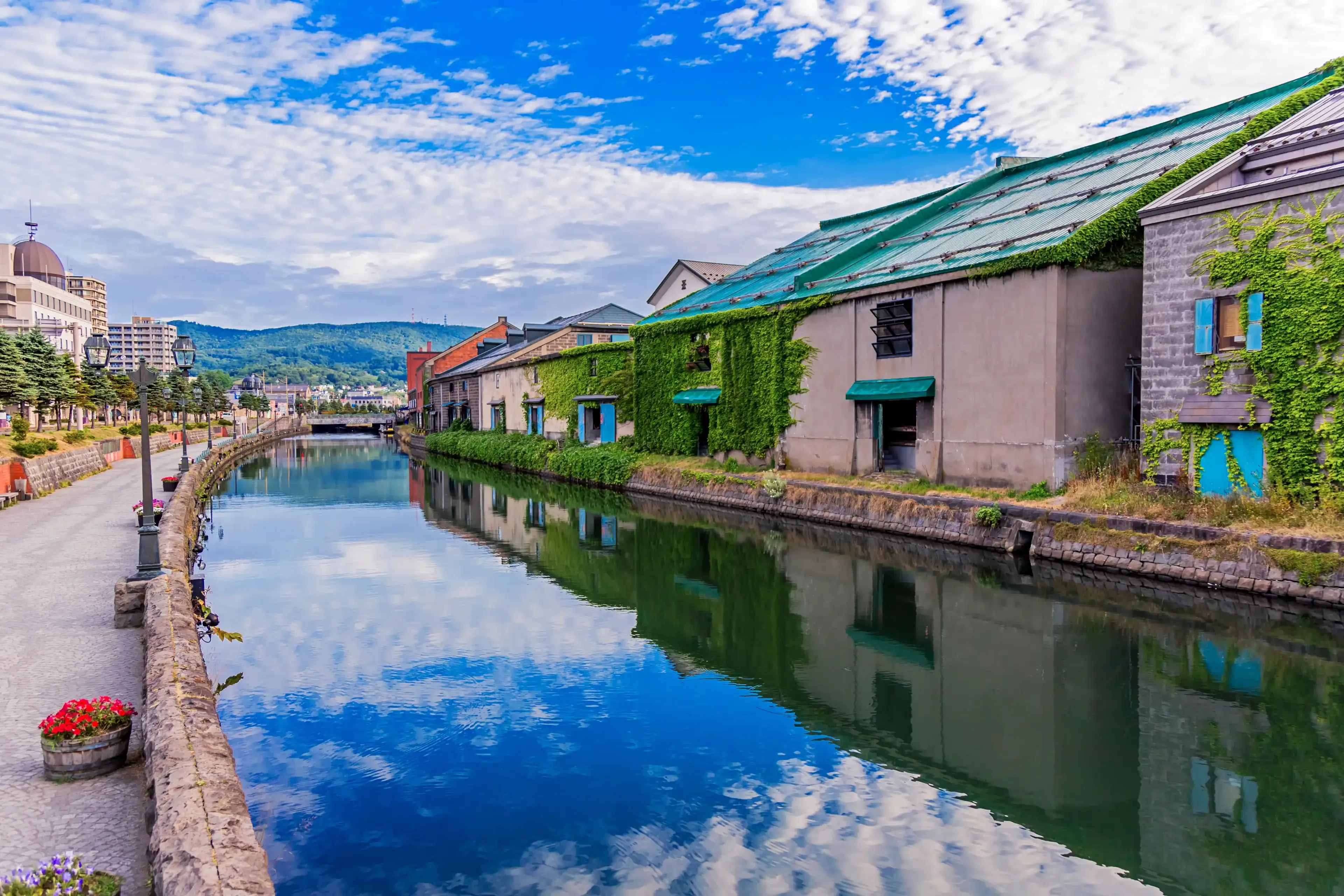 It is a photograph of Otaru canal in Otaru, Hokkaido of Japan. It is early morning in the summer. It is a photograph of Otaru canal in Otaru, Hokkaido of Japan. It is early morning in the summer.