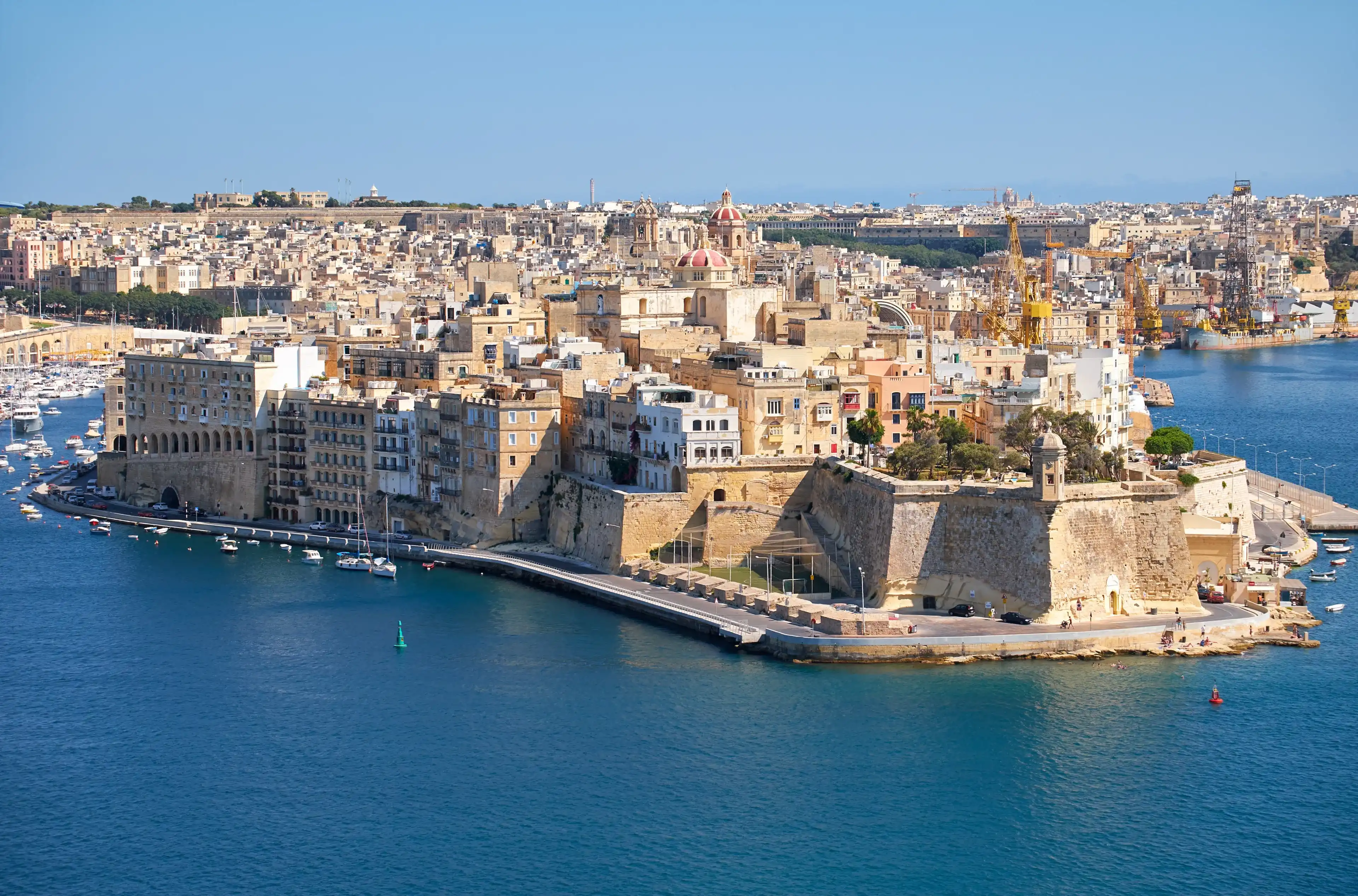 The view of Grand Harbour and Senglea (L-isla) peninsula with Fort Saint Michael on the tip from the bordering terrace of the Upper Barrakka Gardens. Malta 