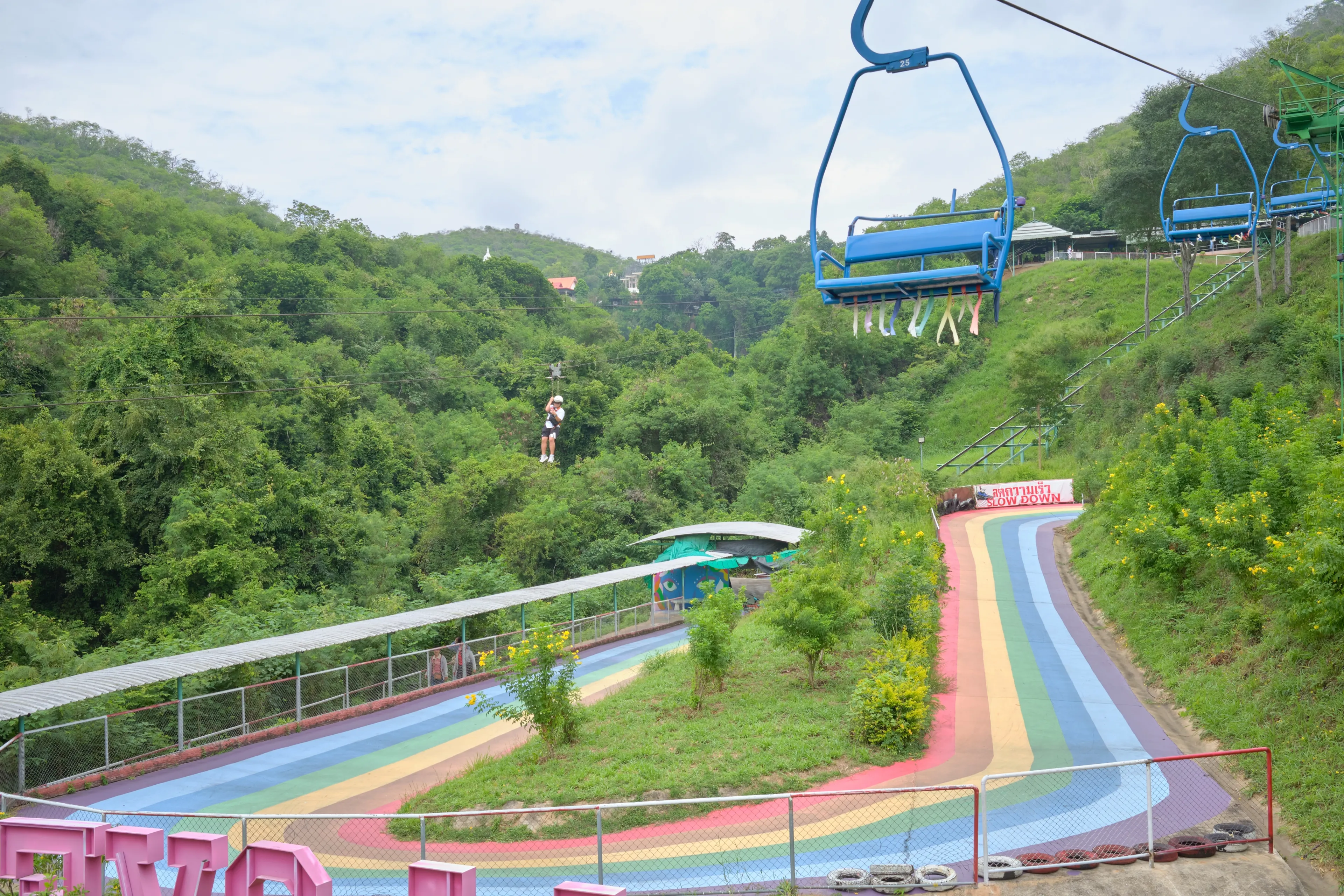 Nakhon Ratchasima, Thailand - Sep 14, 2024 : Tourist are enjoy hanging the Flying Fox down from the hill at Thongsomboon Club near Pak Chong, Khao Yai National Park.