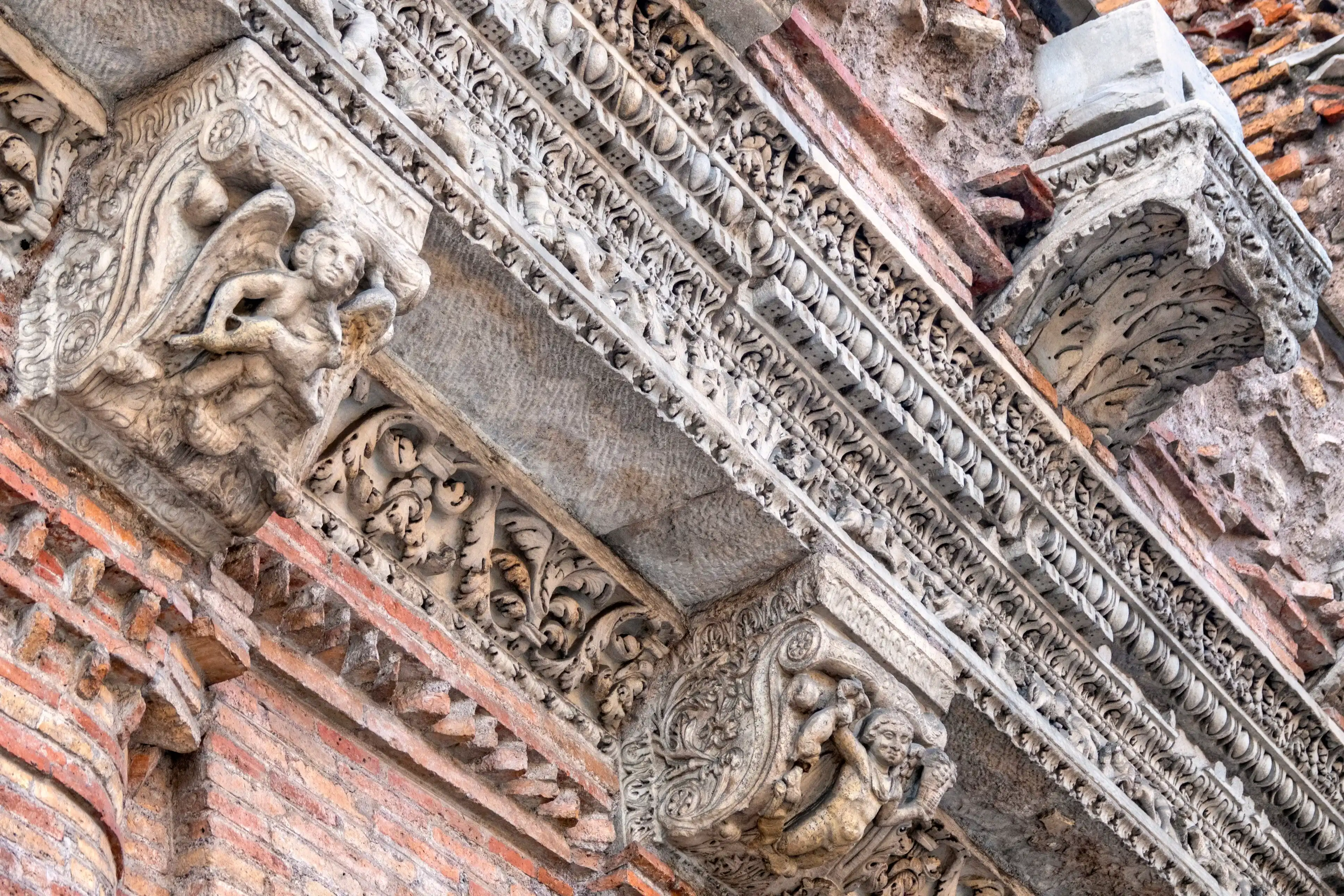 Rome, Italy - 11 10 2019: Detail of the architrave of the Casa dei Crescenzi Rome, Italy - 11 10 2019: Detail of the architrave of the Casa dei Crescenzi