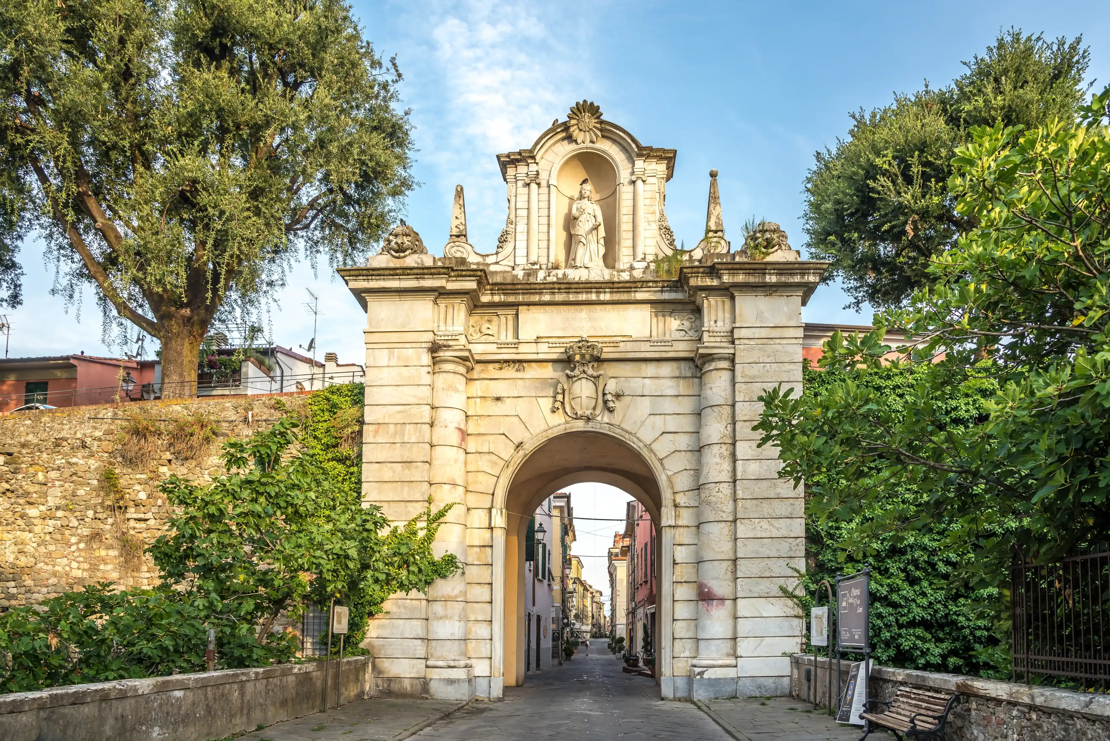SARZANA,ITALY - SEPTEMBER 1,2022 - View at the Porta Romana in the streets of Sarzana. Sarzana is is town in the Province of La Spezia, Liguria, Italy. SARZANA,ITALY - SEPTEMBER 1,2022 - View at the Porta Romana in the streets of Sarzana. Sarzana is is town in the Province of La Spezia, Liguria, Italy.