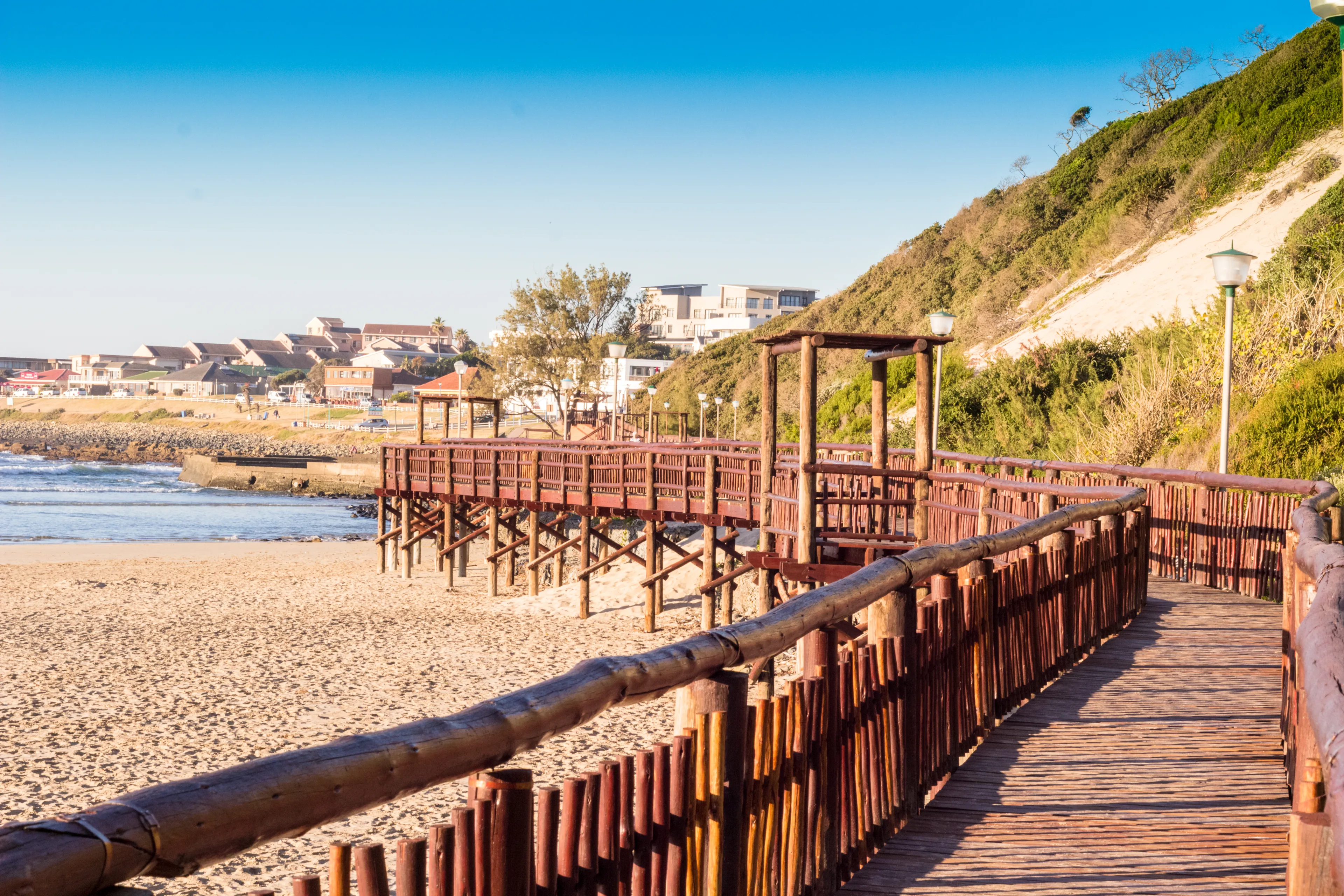 GONUBIE, EAST LONDON SOUTH AFRICA - July 8 2018: Early morning walk on Gonubie boardwalk next to the ocean at low tide