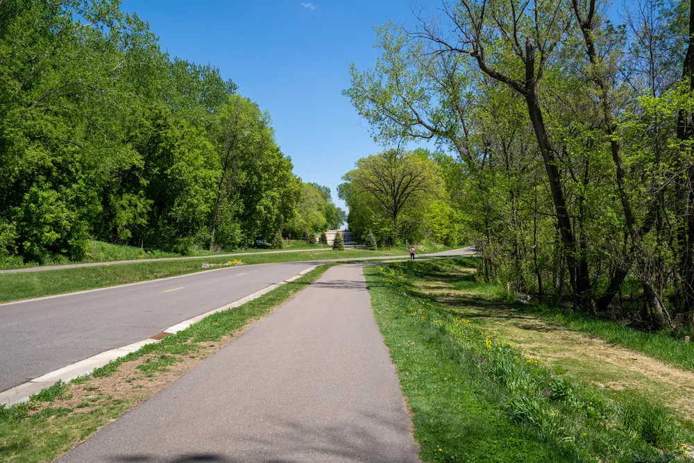 Walking trails near the park road in Clifton E French Regional Park, part of Three Rivers Park District in Plymouth Minnesota