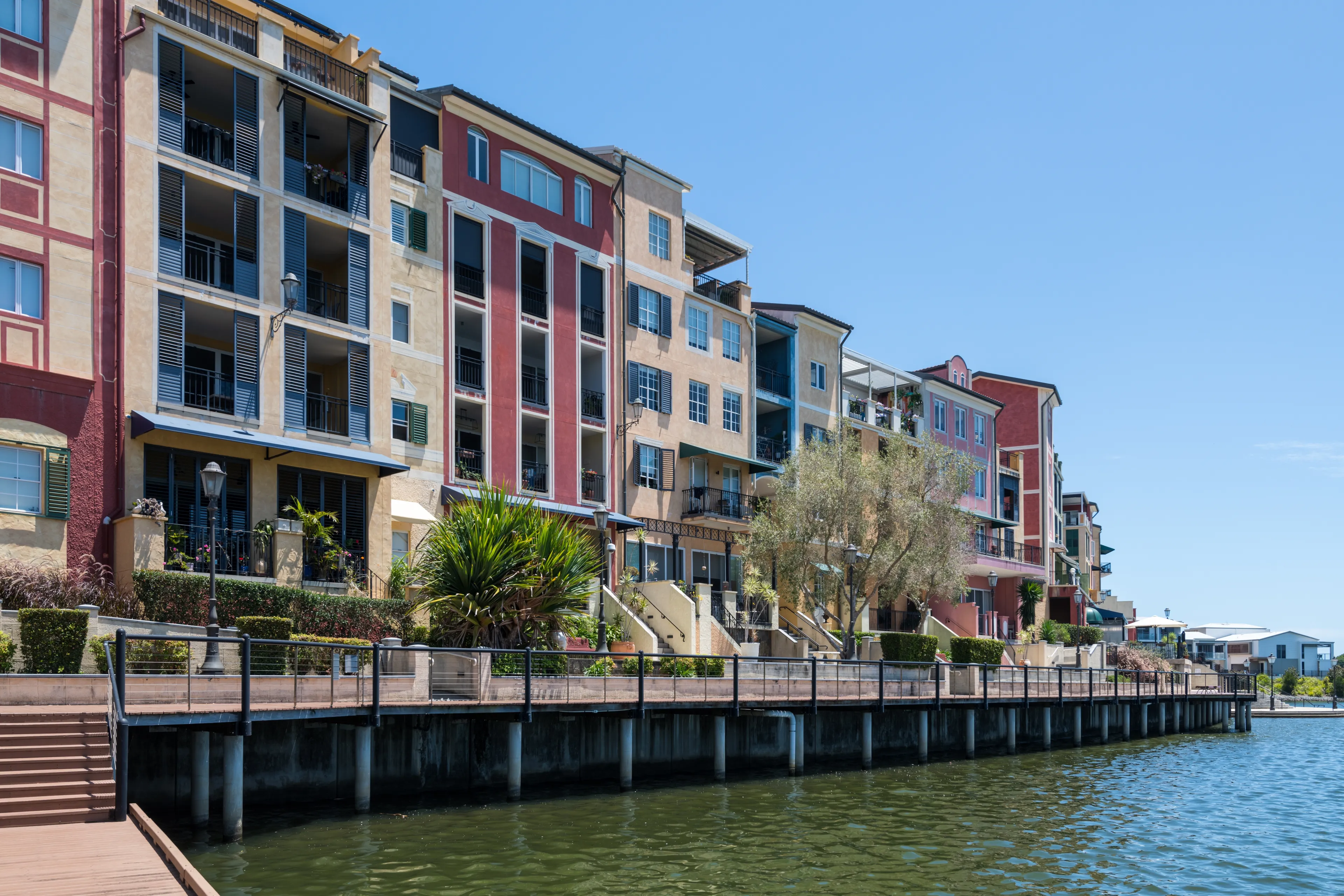 Gold Coast, Queensland Australia – January 9 2023: Colourful architectural apartments Emerald Lakes Carrara