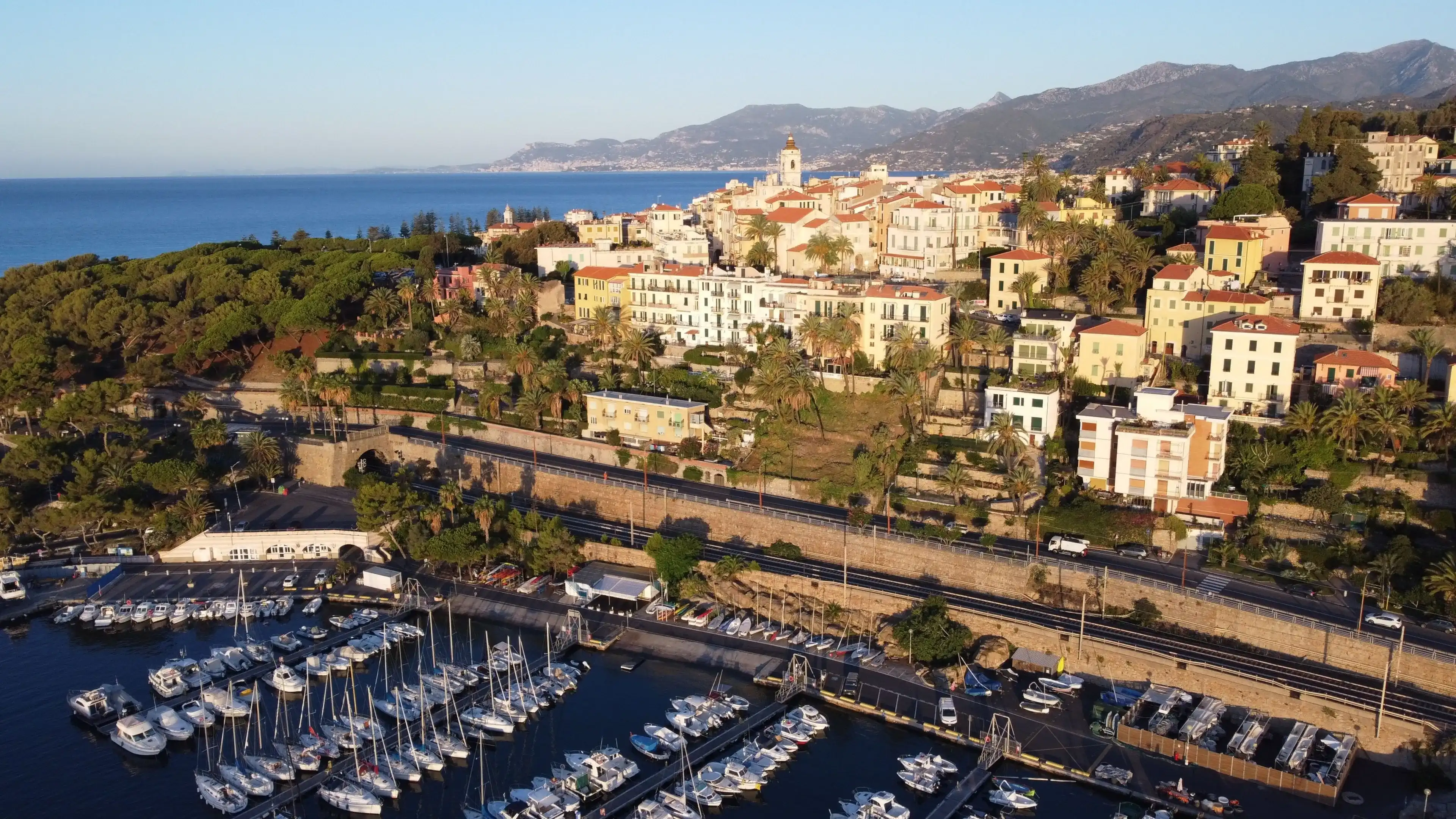 A drone shot of boats near the docks of the harbor next to Bordighera, Italy A drone shot of boats near the docks of the harbor next to Bordighera, Italy