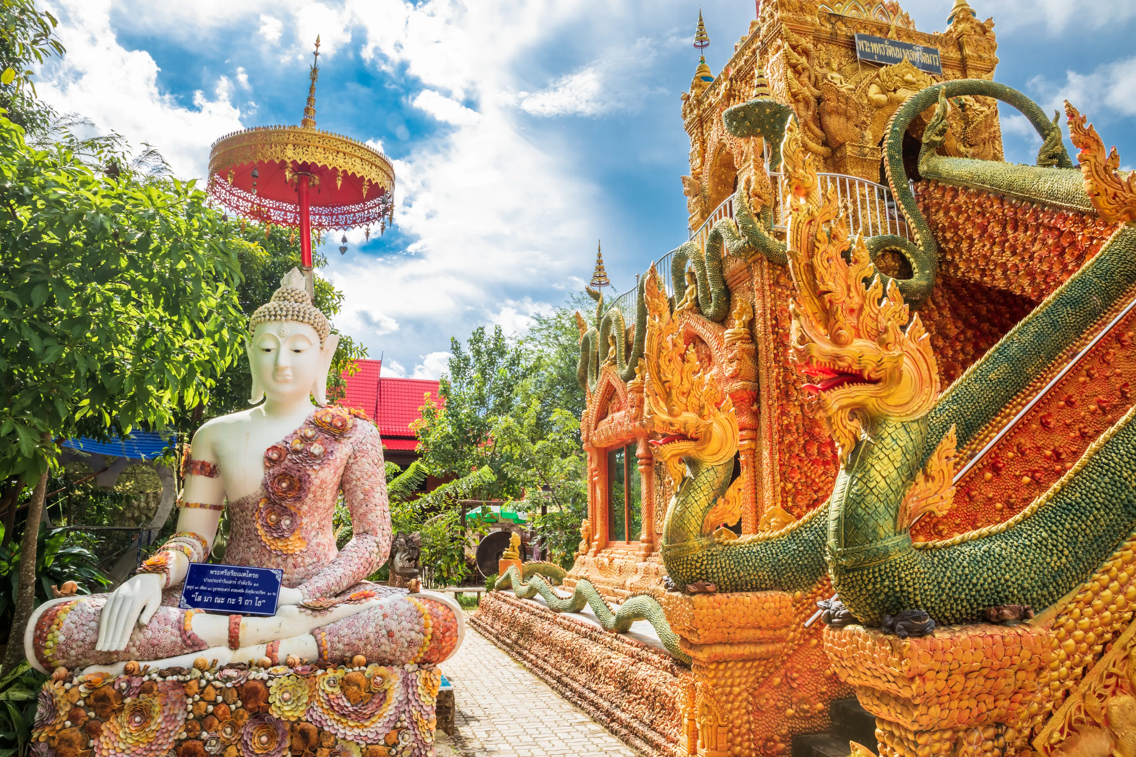 Buddha in sitting decorated with many kinds of shells at the base. The highlight of Rattanet Ta Ram temple,Prachin buri,Thailand