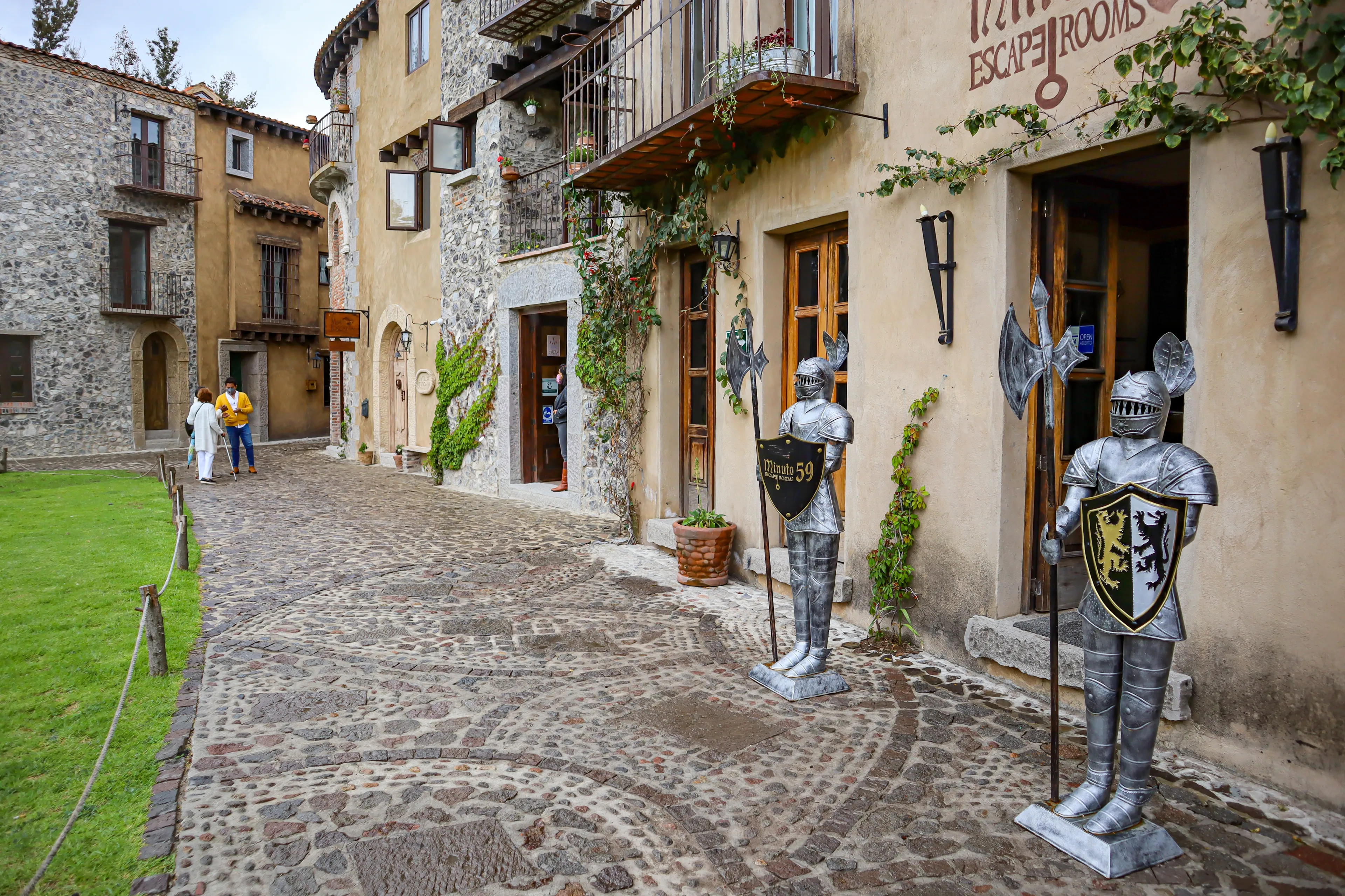 Tlaxcala, Mexico - June 2021: Armor guarding the entrance of an escape room in the town of Val'Quirico, a place where tourists can enjoy amenities and international food restaurants.