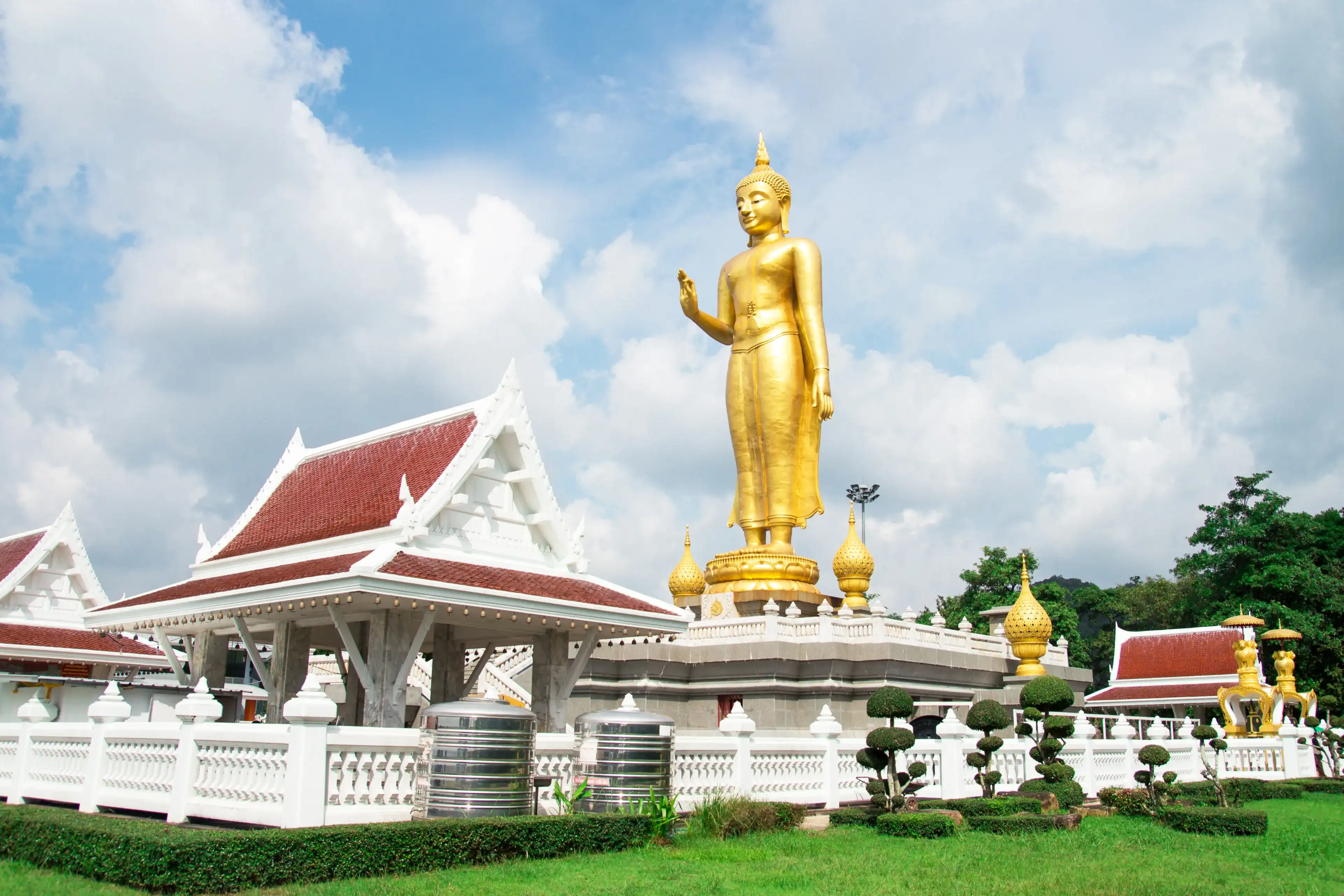 A golden buddha statue on the mountain top at Hat Yai municipality public park, Songkhla Province, Thailand