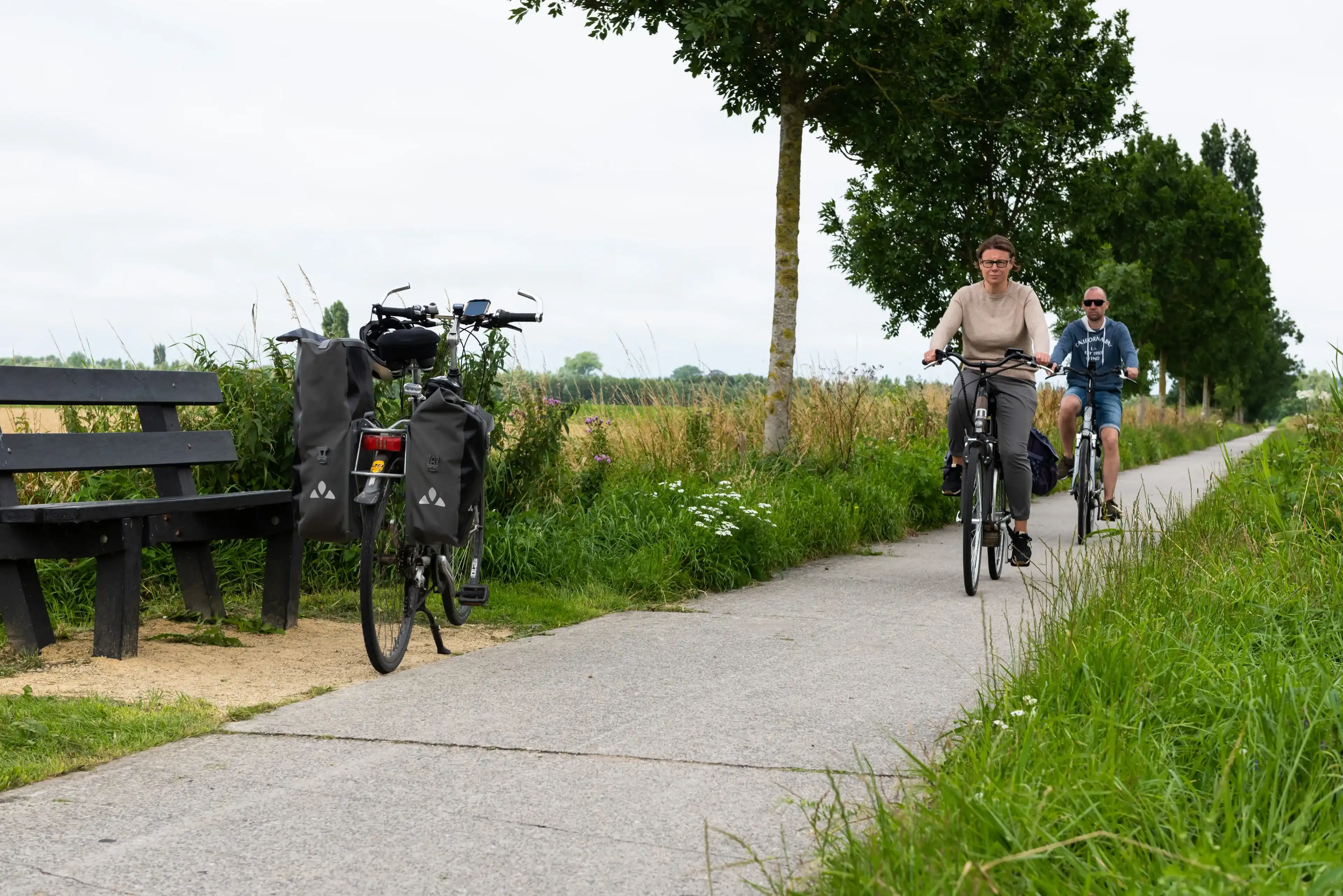 Veurne, West Flanders Region - Belgium - 07 18 2021 Recreative cycling path with biking couple