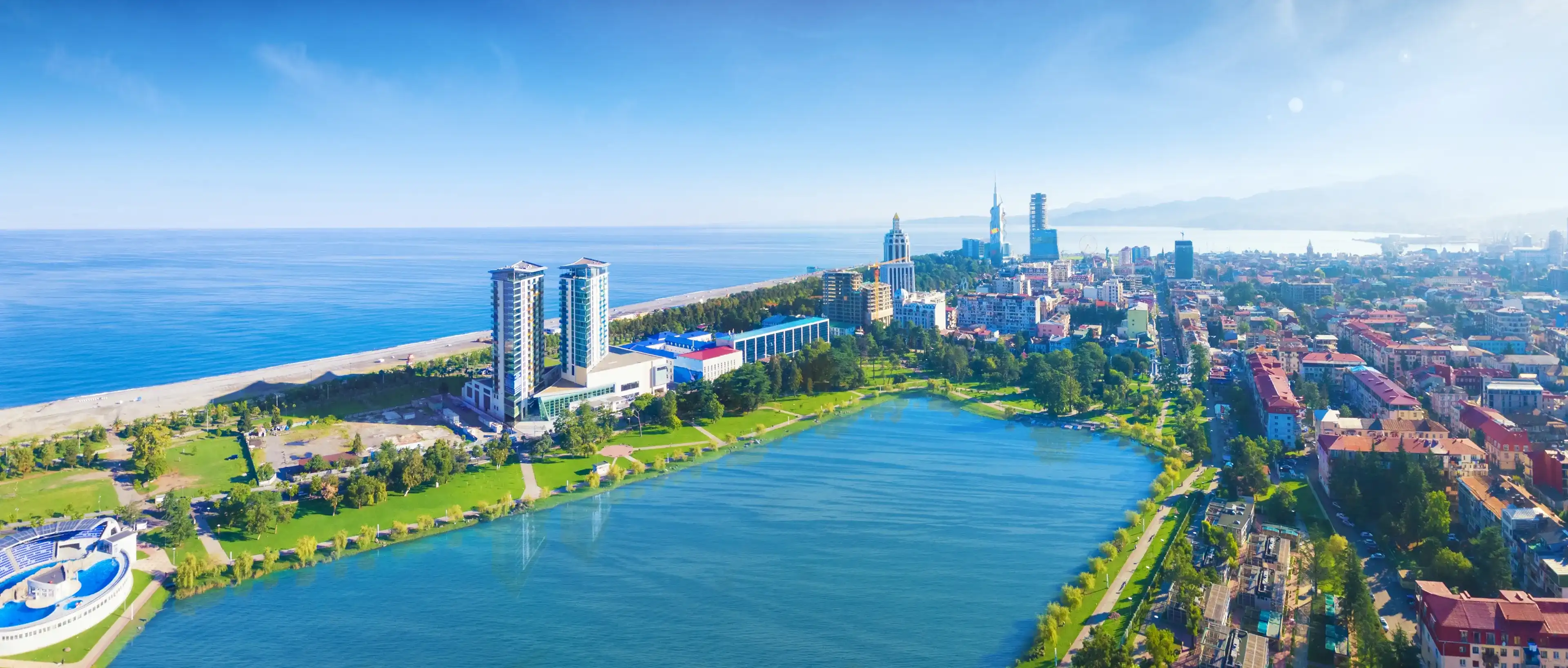 Aerial panoramic image of beautiful Batumi made with drone in sunny summer weather. Batumi is capital of Autonomous Republic of Adjara in Georgia, located on coast of Black Sea.