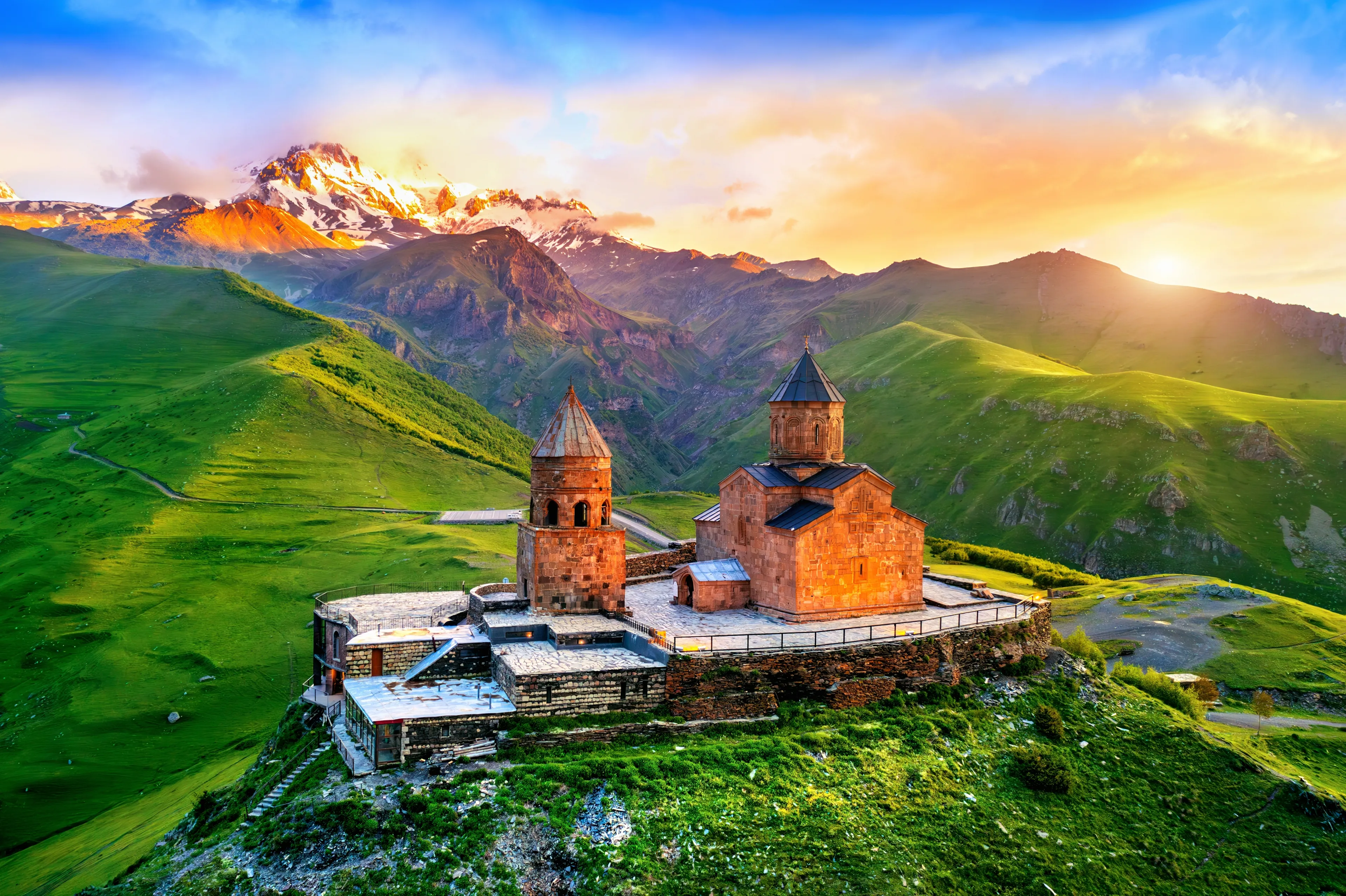 Aerial view of Gergeti trinity church at sunrise in Georgia.