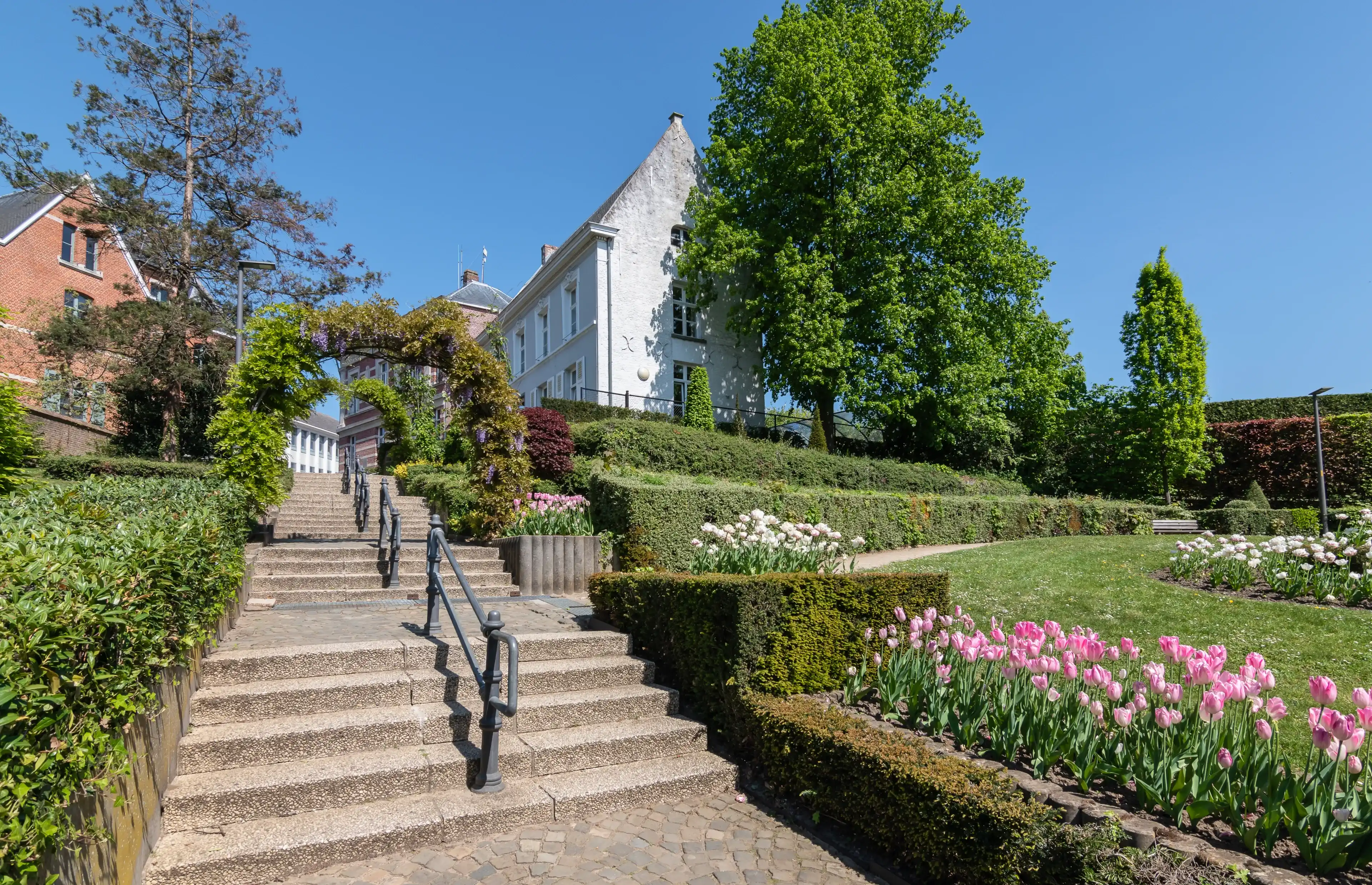 Public park with stairs and a beautiful landscaped spring garden located on the mountain in the village center of Heist-op-den-Berg, province of Antwerp, Belgium.