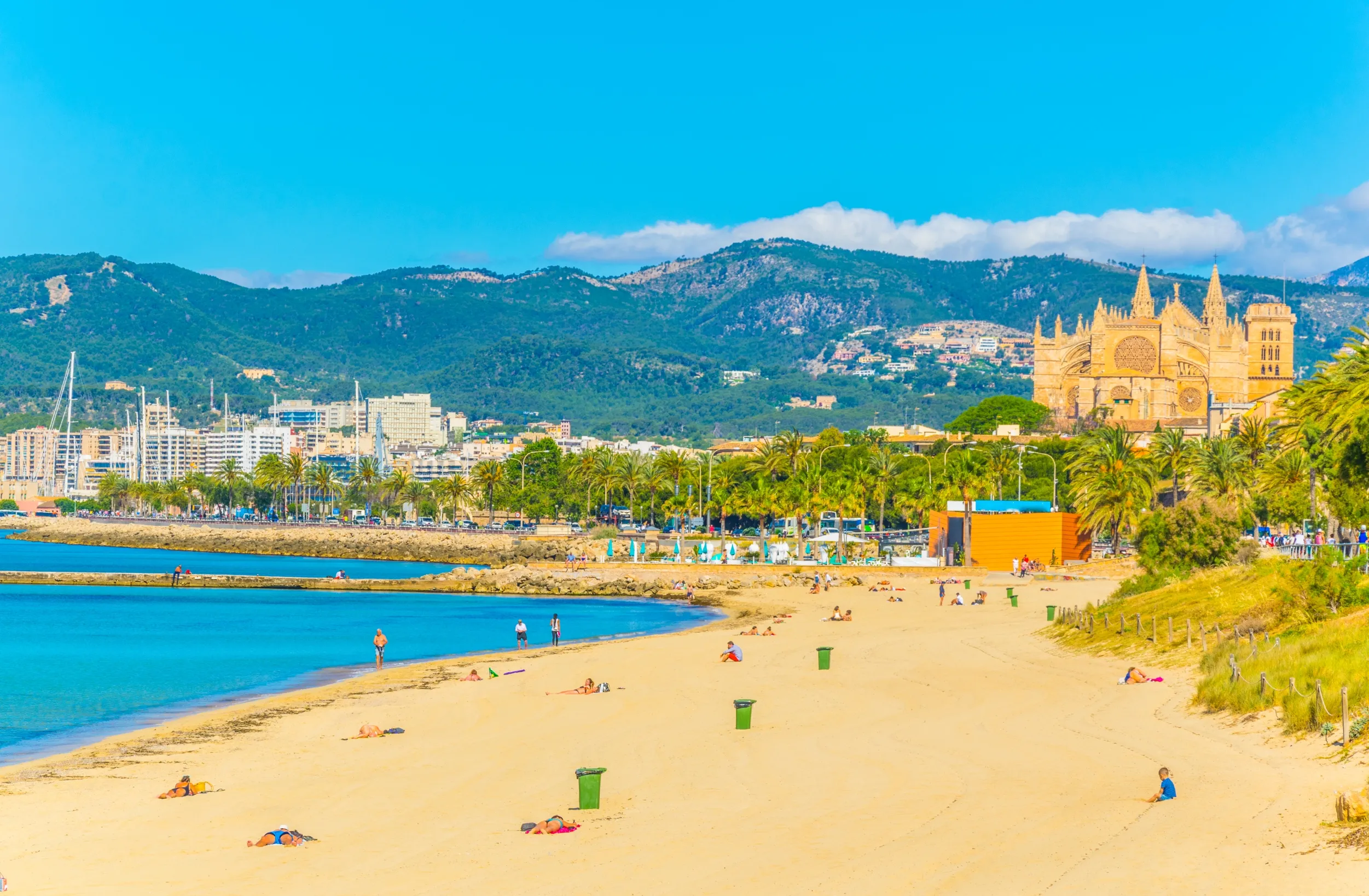 Beach at Palma de Mallorca with the cathedral at background, Spain