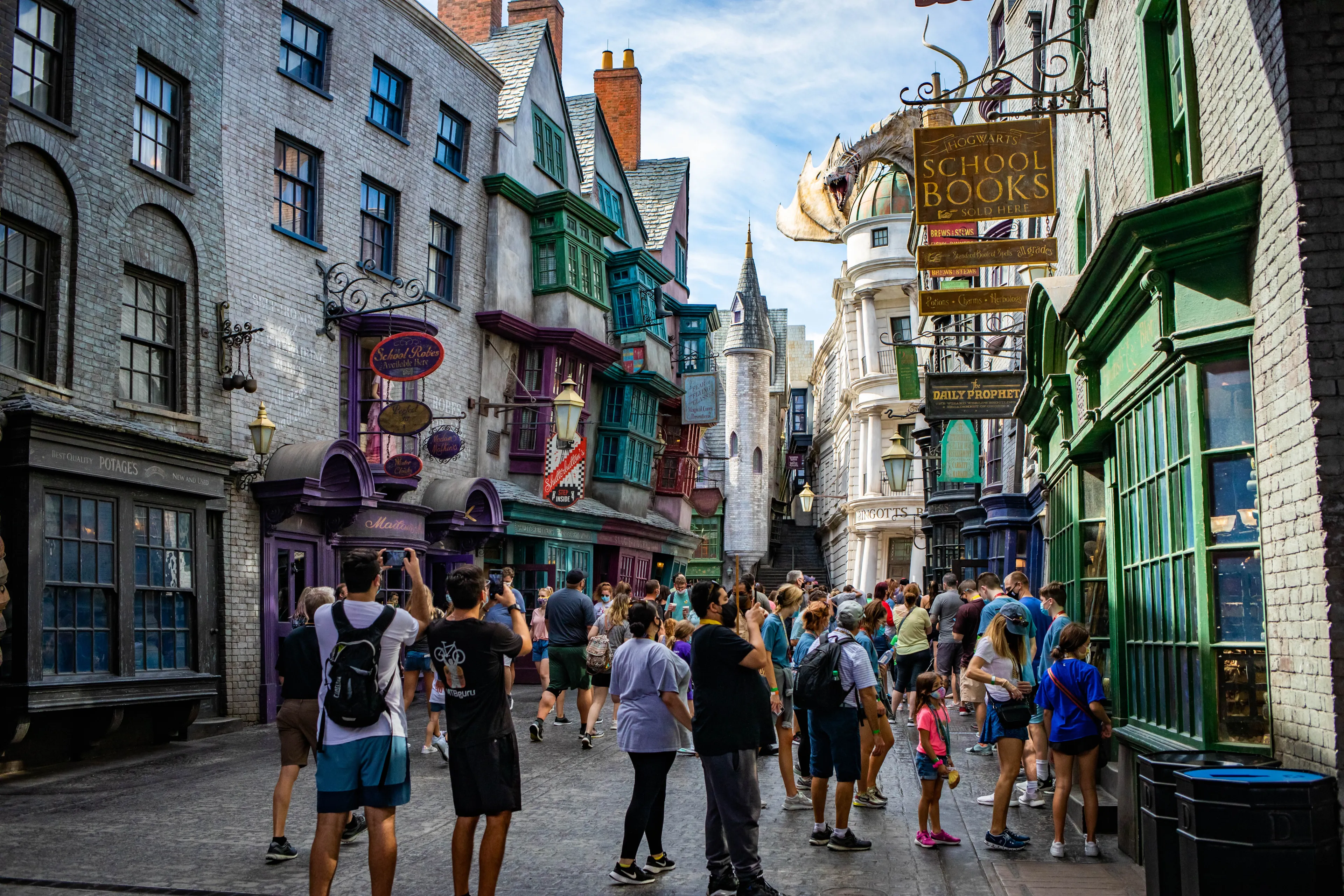 Orlando, USA - Feb. 12, 2021: Fire breathing dragon on top of Gringotts bank at Harry Potter World
