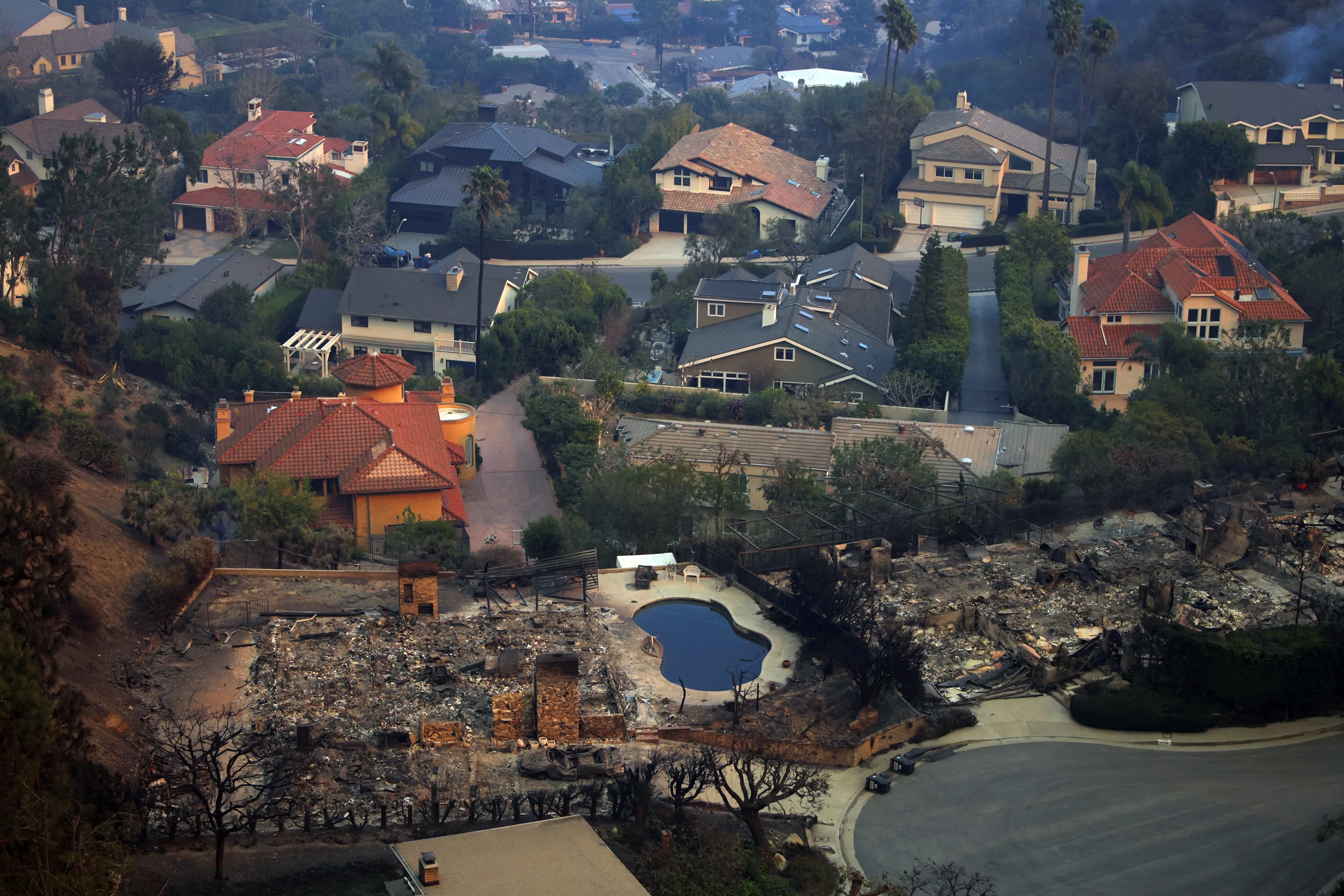 Debris litters the ground of a burnt house in the Pacific Palisades neighborhood, following powerful wind-driven wildfires that forced evacuations in Los Angeles, California.