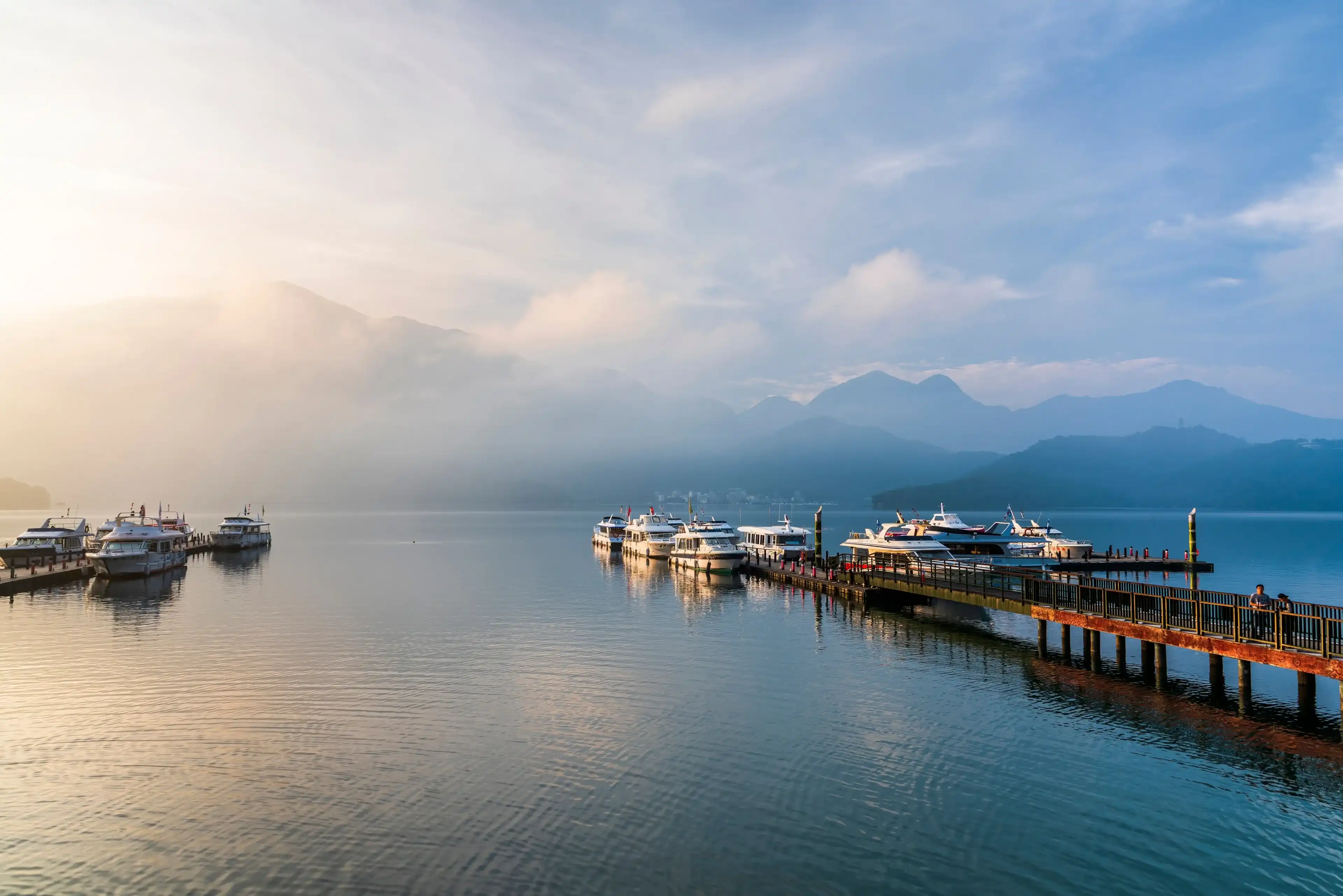 Nantou, Taiwan- September 6, 2017: The scenery of the Yacht Marina at Sun Moon Lake in the morning is a famous attraction in Nantou, Taiwan. Nantou, Taiwan- September 6, 2017: The scenery of the Yacht Marina at Sun Moon Lake in the morning is a famous attraction in Nantou, Taiwan.