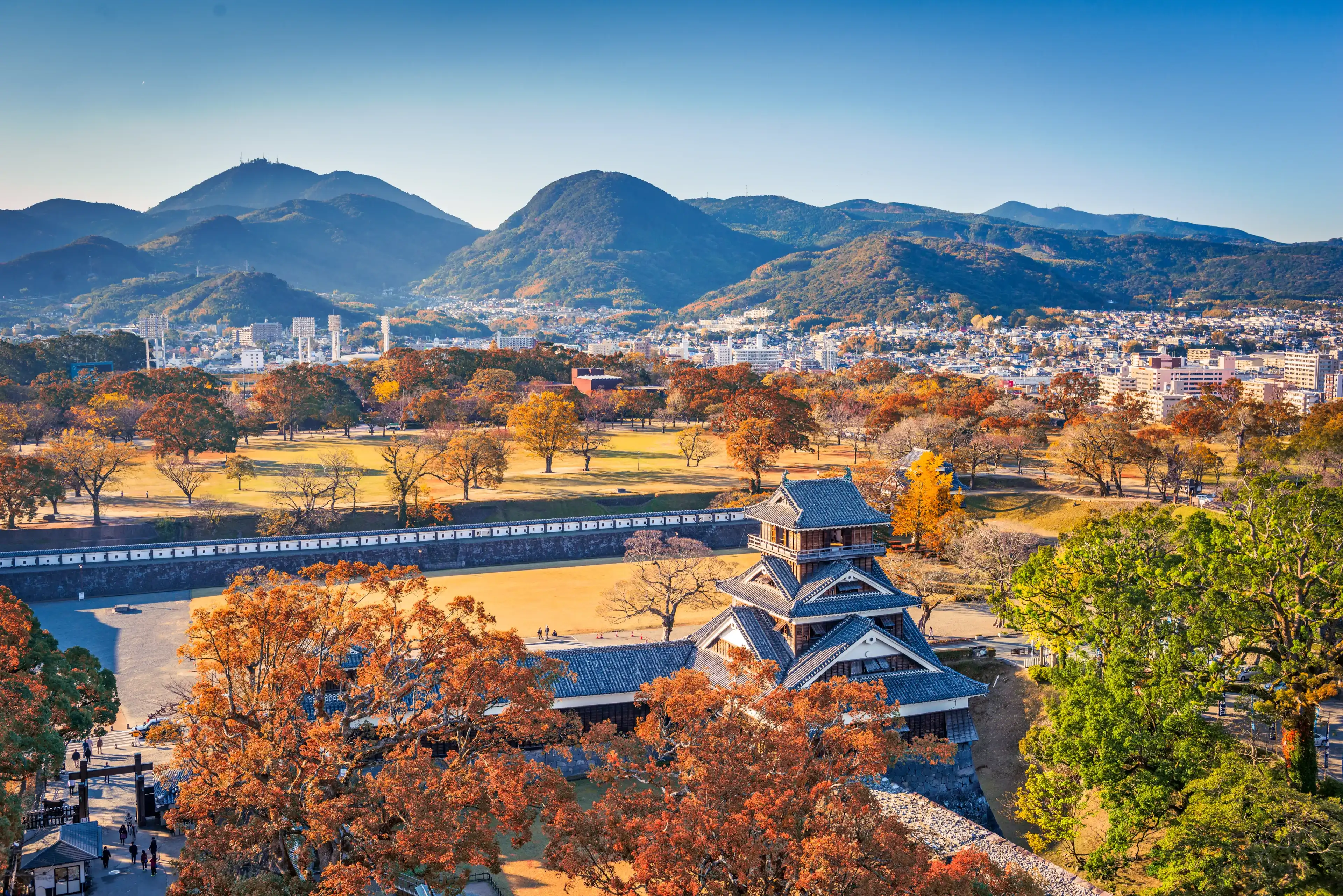 Kumamoto Castle Turret and the landscape of Kumamoto, Japan in autumn.