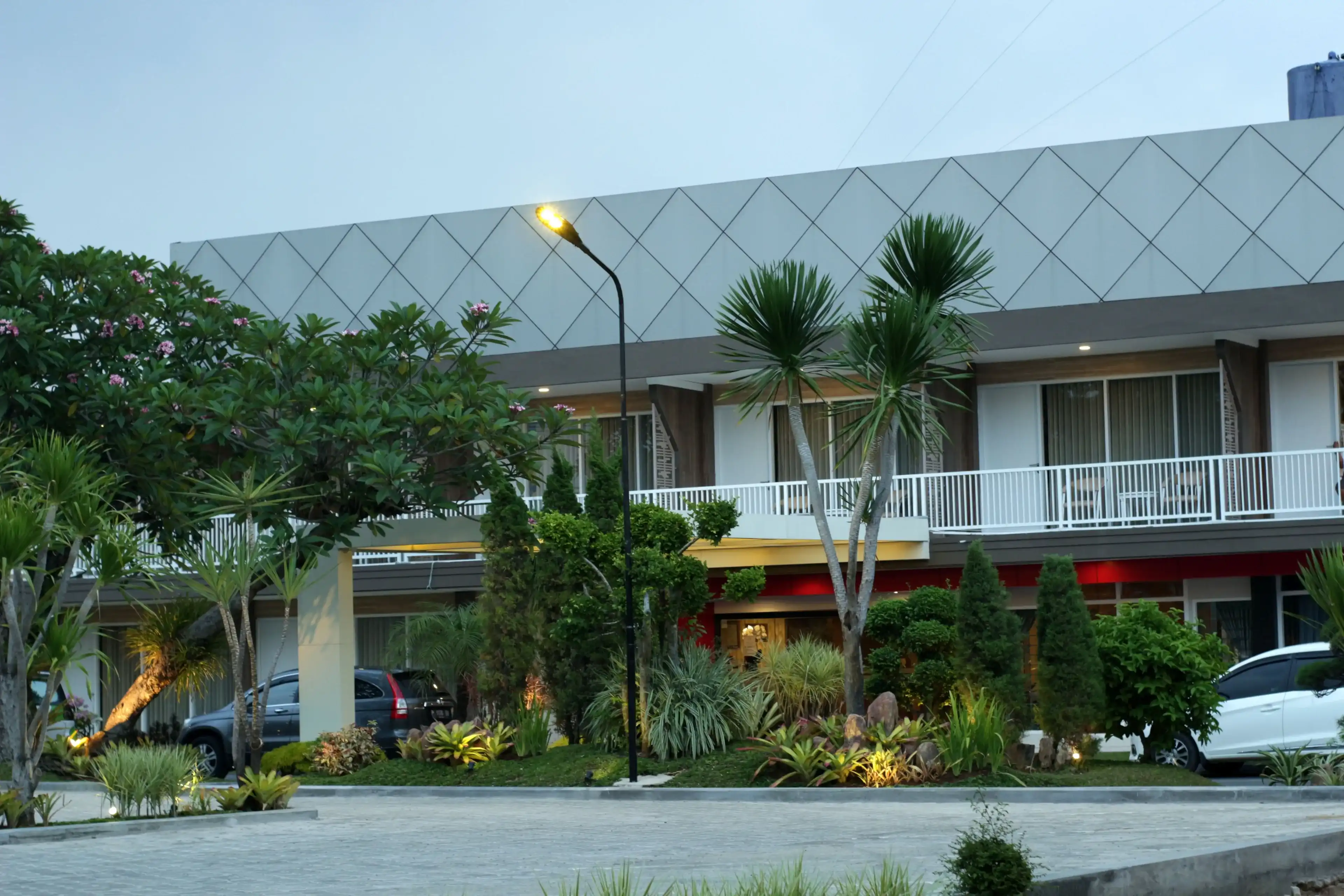Pekalongan, Indonesia - April 19, 2018 : View of the hotel front yard. Pekalongan, Indonesia - April 19, 2018 : View of the hotel front yard.