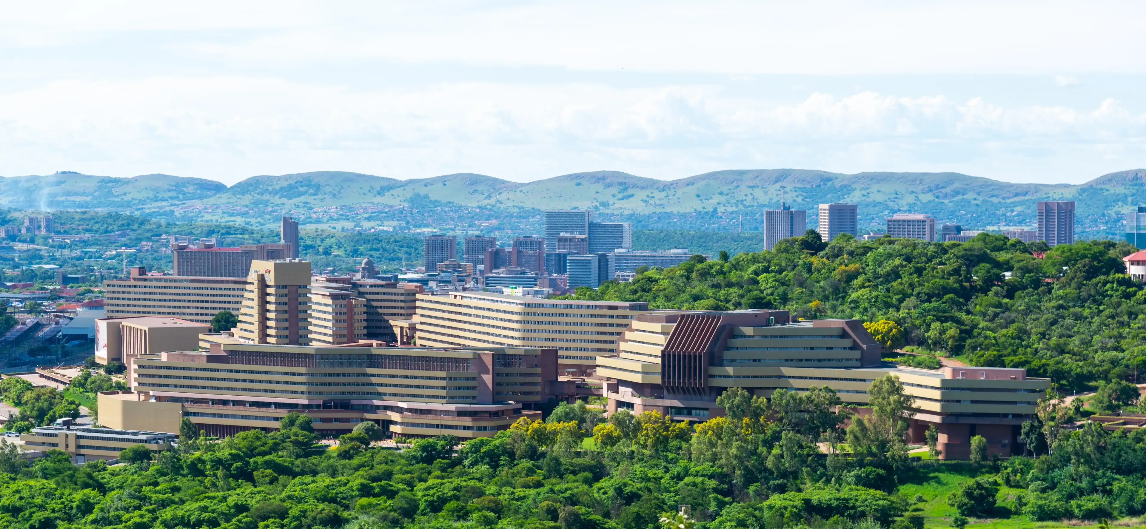 Pretoria, Gauteng, South Africa - Dec. 20 2020: The University of South Africa between the green trees of a rainy season summer. A world class distance learning facility.