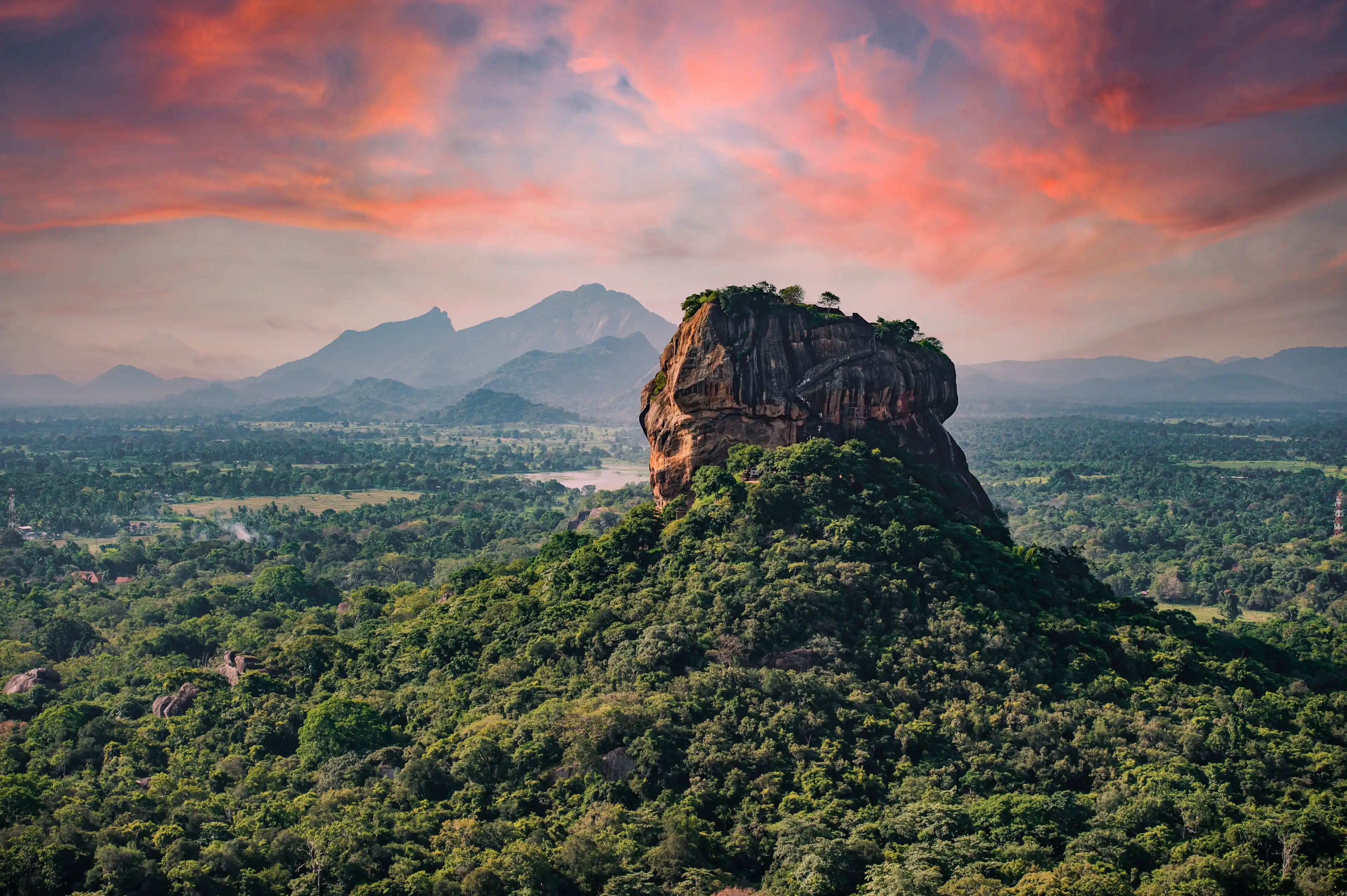 (Selective focus) Spectacular view of the Lion rock surrounded by green rich vegetation. Picture taken from Pidurangala Rock in Sigiriya, Sri Lanka. (Selective focus) Spectacular view of the Lion rock surrounded by green rich vegetation. Picture taken from Pidurangala Rock in Sigiriya, Sri Lanka.