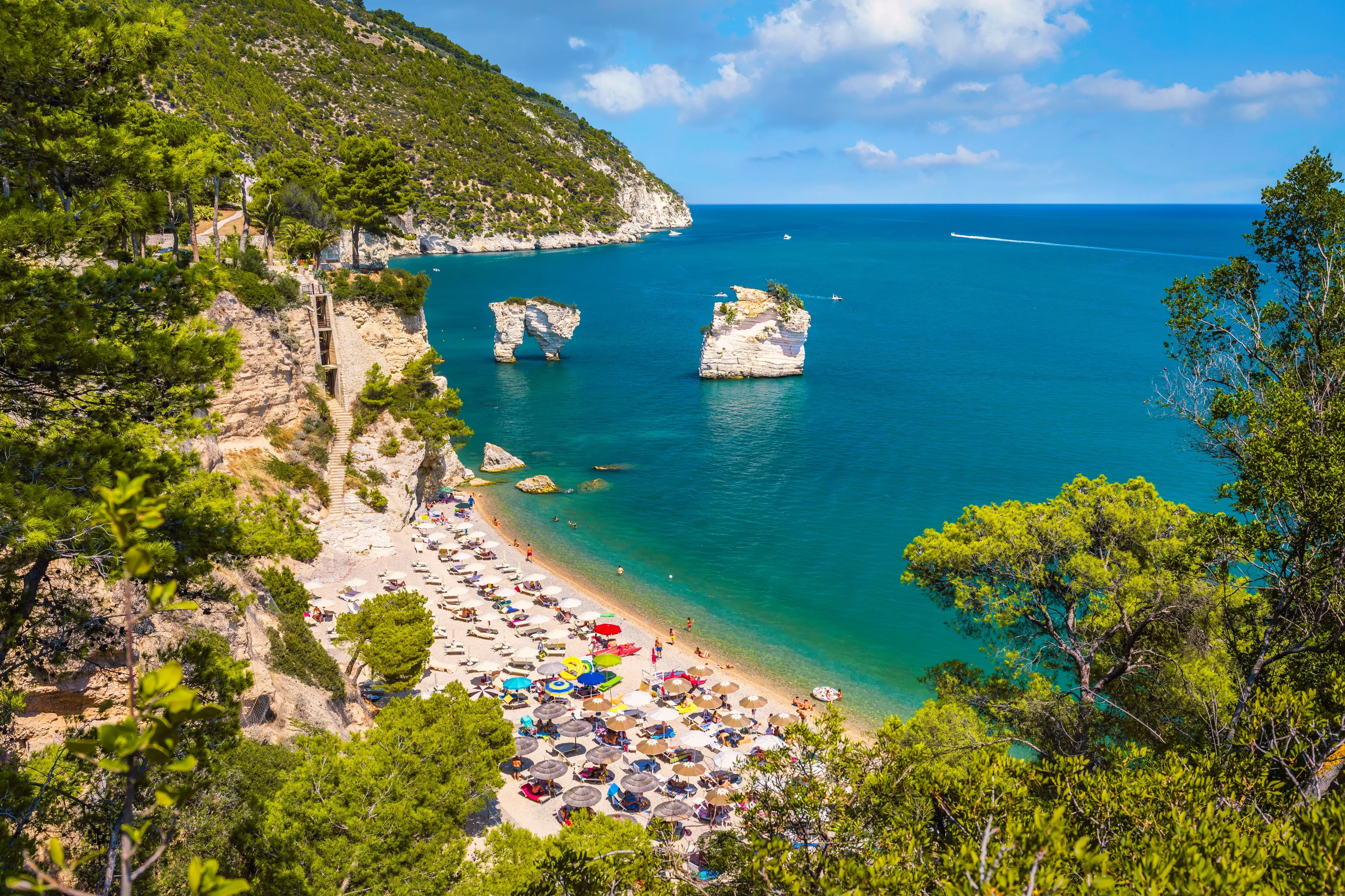 Panoramic view of famous Baia delle Zagare (Zagare Bay) or Baia dei Mergoli (Mergoli Bay) with Faraglioni di Puglia, Gargano National Park, Puglia, Italy
