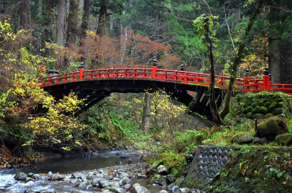 Haguro Mt, Tsuruoka, Japan - November 11, 2018: Red bridge at Haguro Mountain Haguro Mt, Tsuruoka, Japan - November 11, 2018: Red bridge at Haguro Mountain