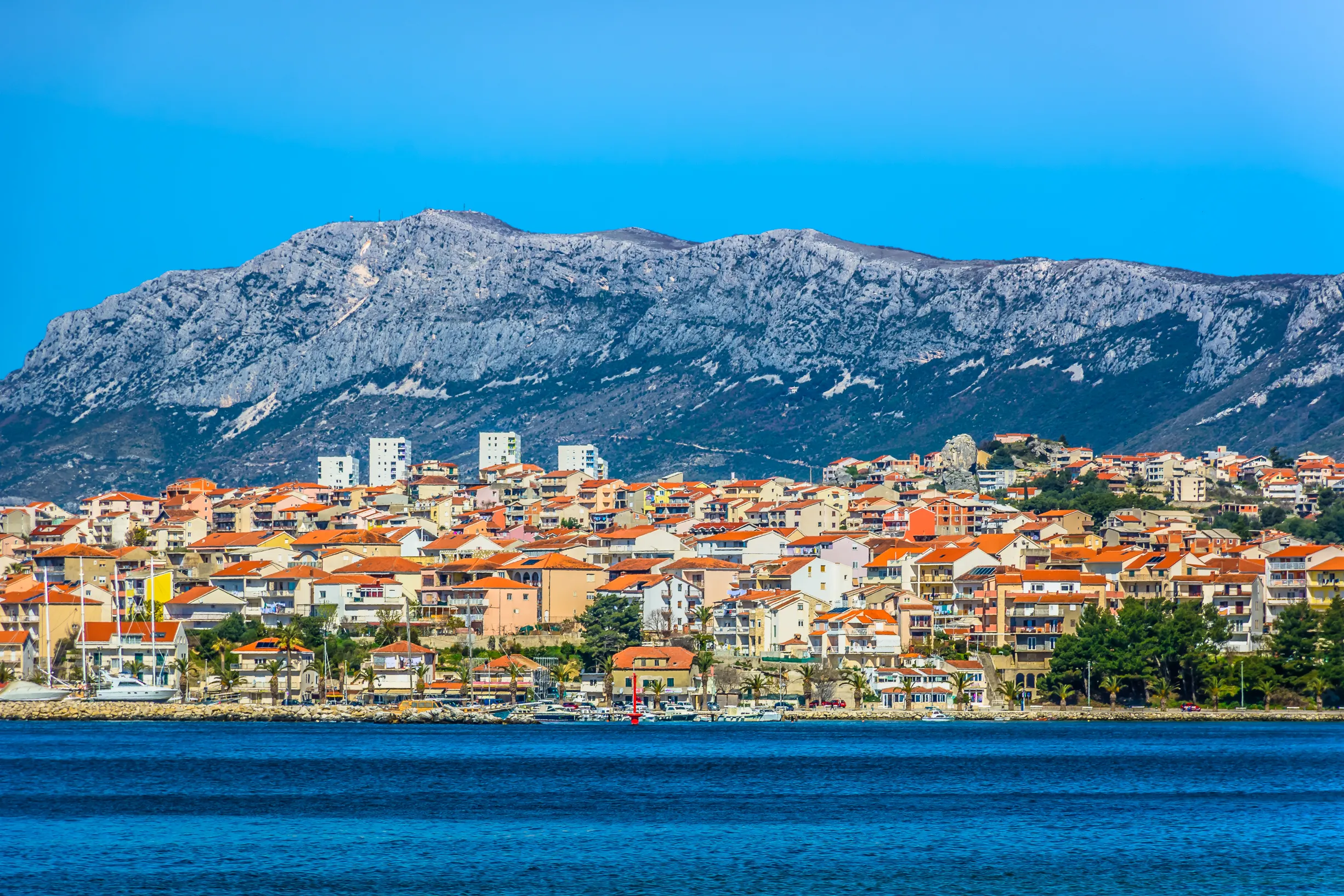 Seafront view at picturesque small town Podstrana in suburb of Split city, Croatia Mediterranean. / Selective focus.
