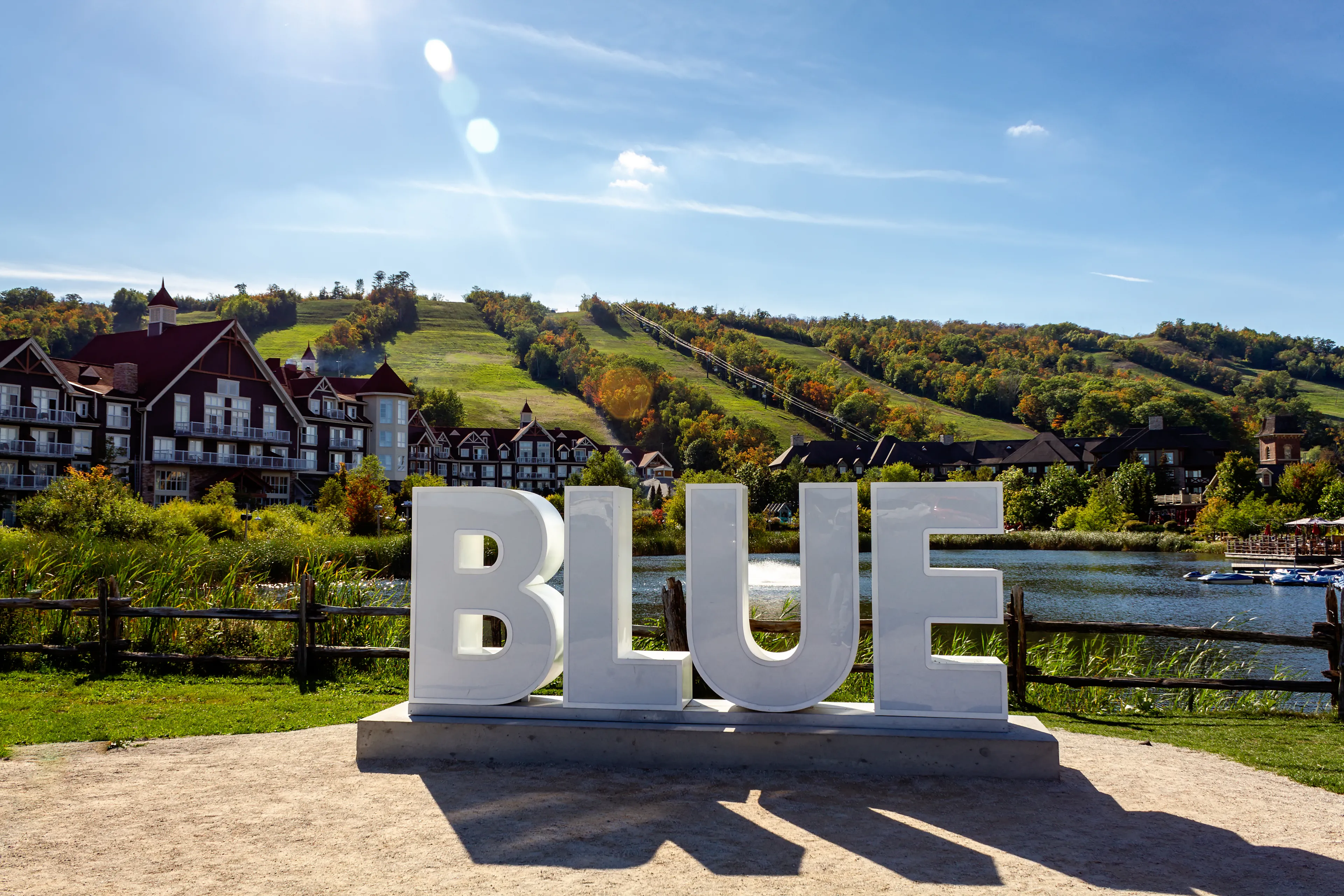 View of Mill pond and and BLUE sign, Blue Mountains Village, Ontario, Canada