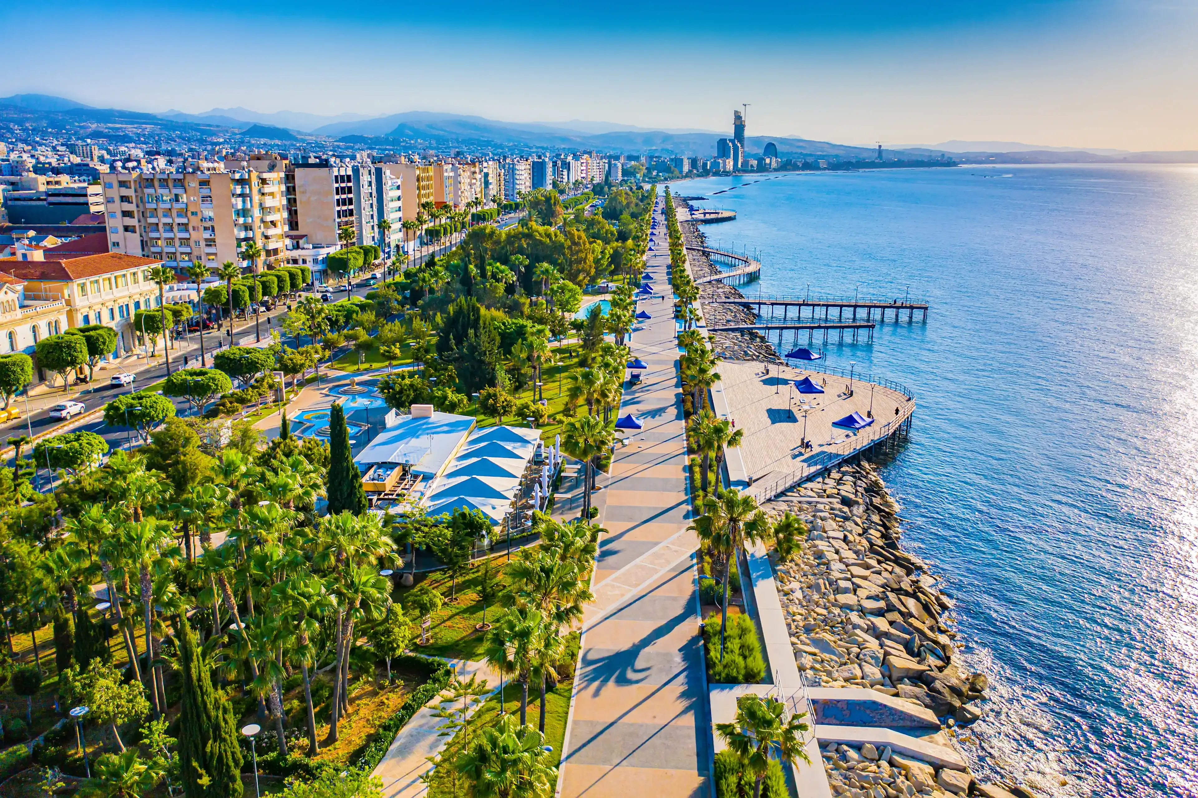 Limassol. Cyprus. The seafront of Limassol Molos bay panorama by drone. Hotels on Limassol waterfront from a height. Mediterranean. Cyprus beaches. Hotel vacation on the coast of Cyprus.