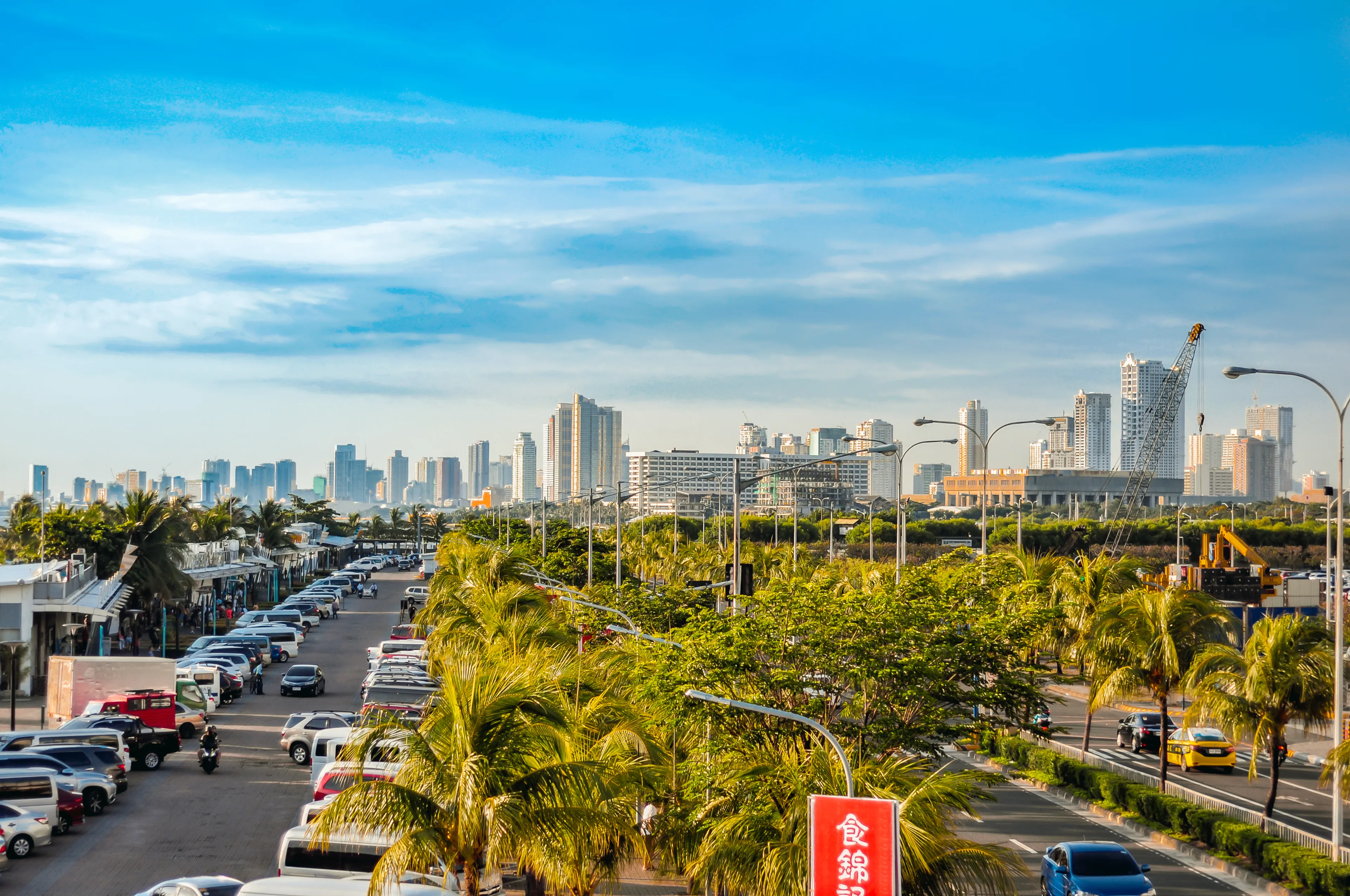 Manila, Philippines - July 3, 2019 - Skyline of Metro Manila, View from SM Mall of Asia, by the bay, Manila Bay