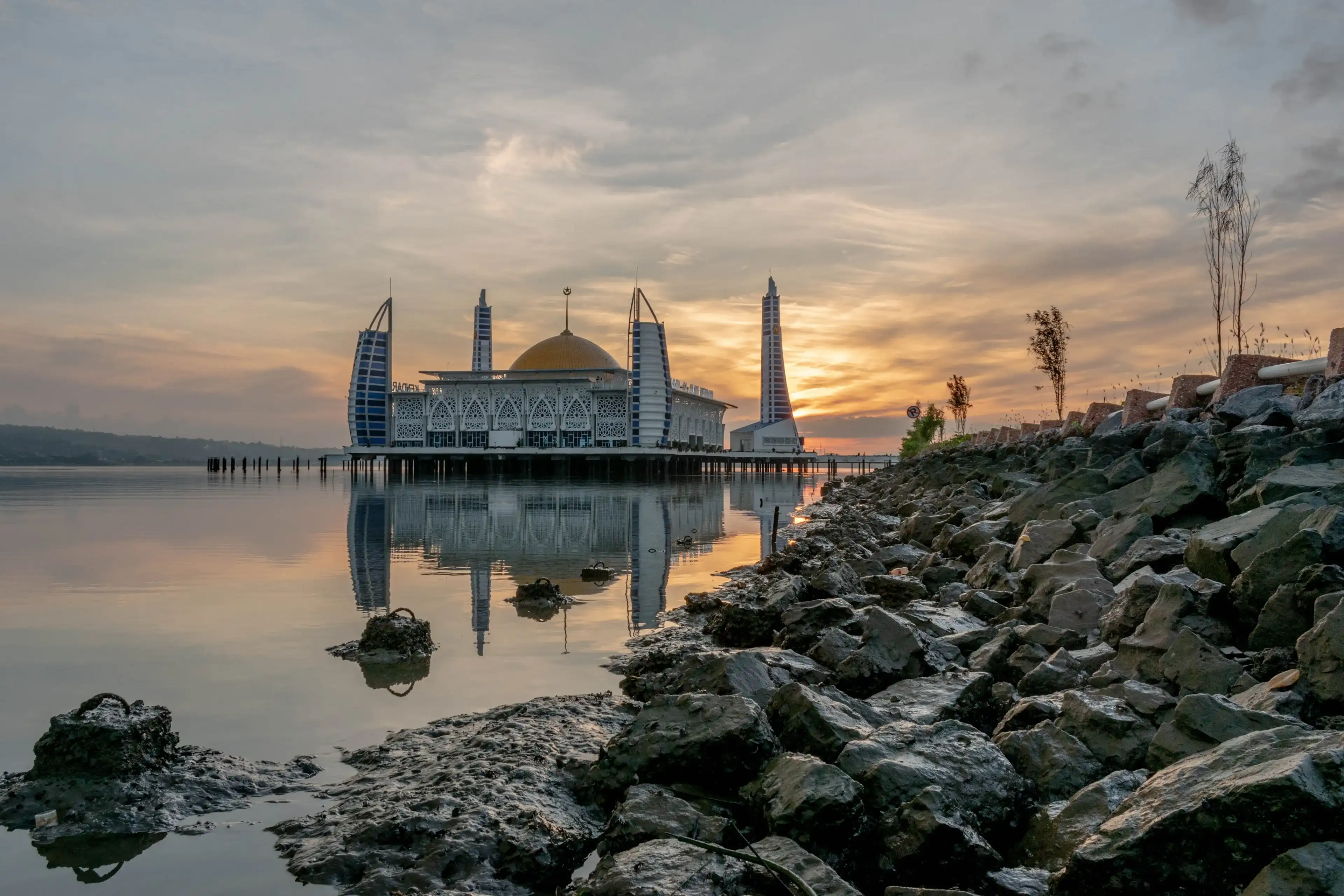 Kendari, Indonesia - 26 October 2023: Al-Alam Mosque, one of the mosques in Kendari City, Southeast Sulawesi, which was built on the water surface of Kendari Bay which has beautiful sea views.