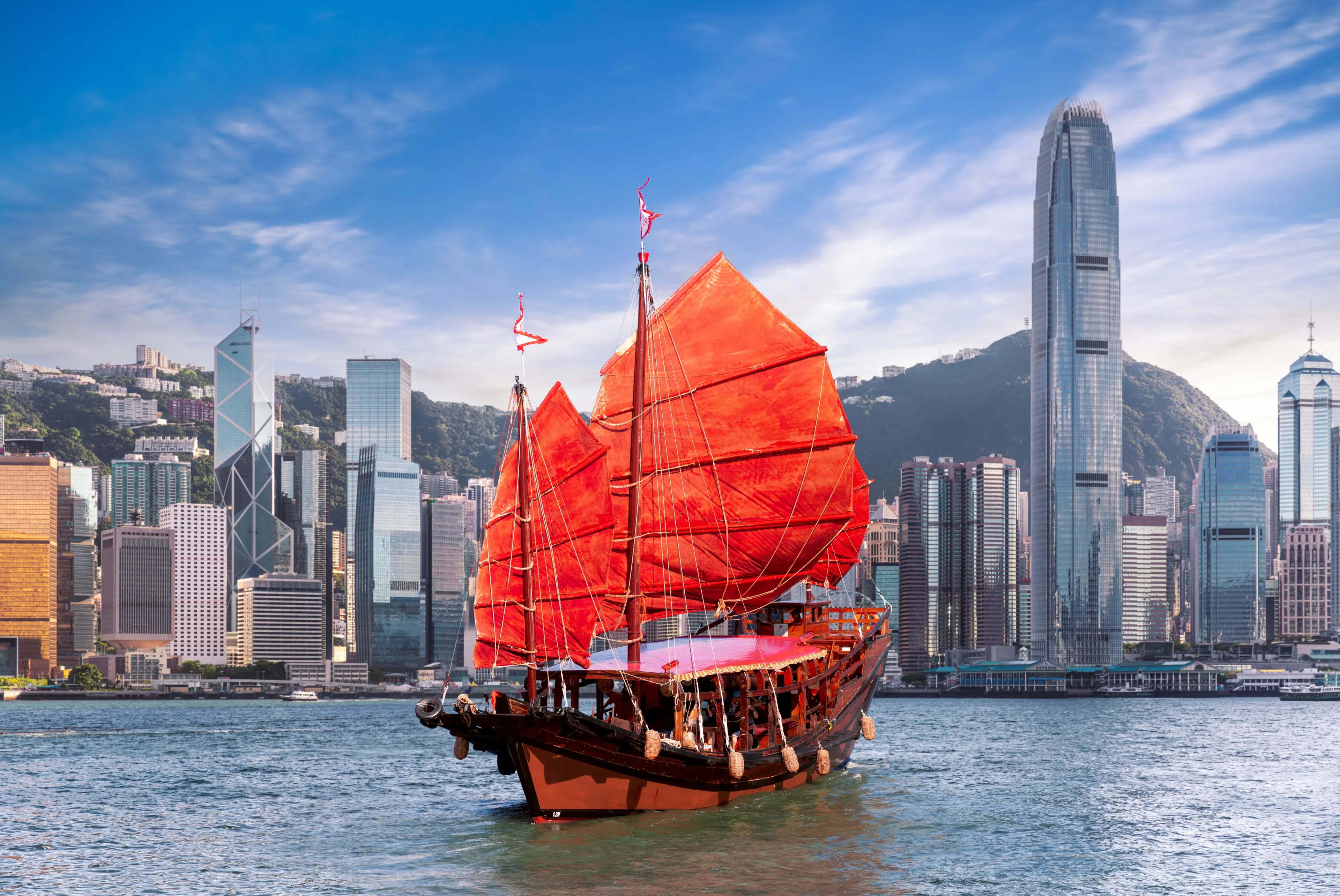 Red vintage sailboat for tourist pass from Hong king city side to kowloon city, Hongkong icon for travel, China