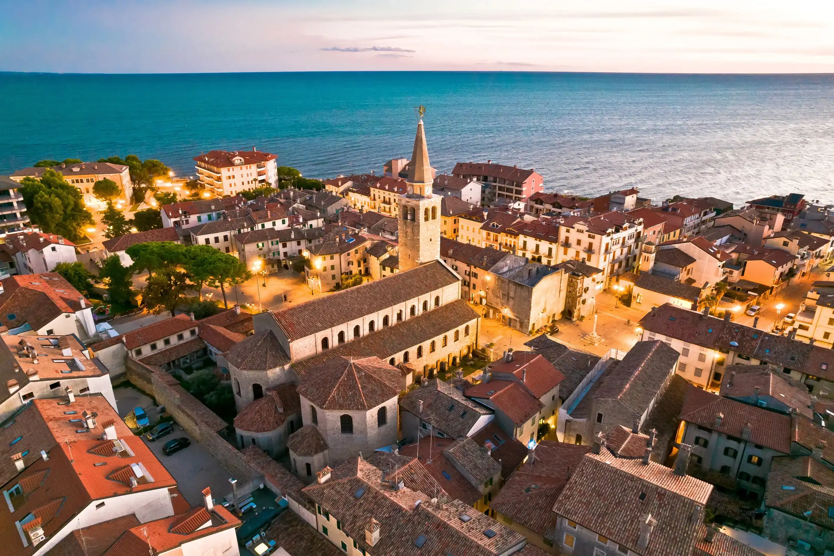Town of Grado church and waterfront aerial evening view, Friuli-Venezia Giulia region of Italy Town of Grado church and waterfront aerial evening view, Friuli-Venezia Giulia region of Italy