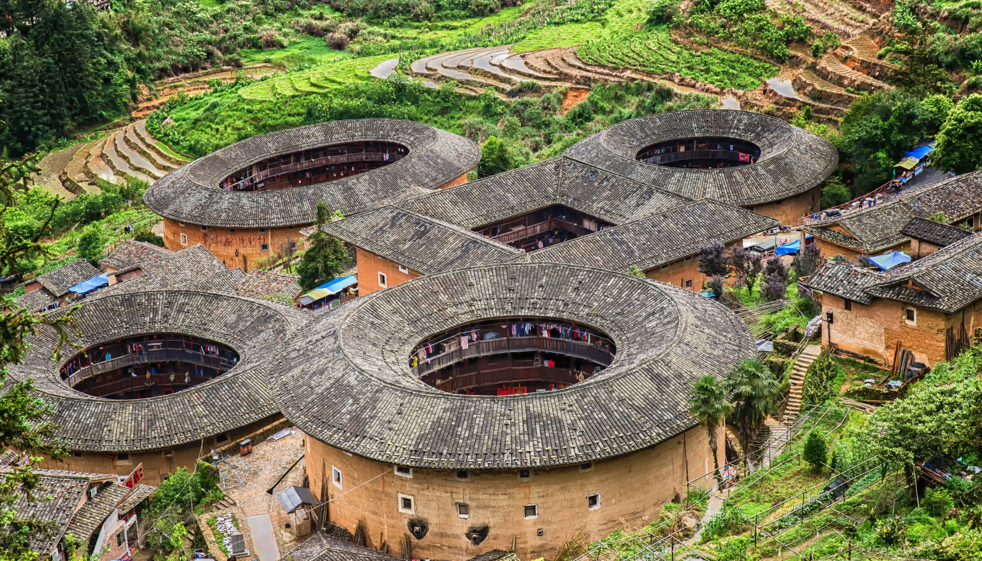 Traditional earthen Tulou Chinese huts, a landmark tourist attraction from the Fujian province of China. These large round huts are still being lived in today by the Hakka people.