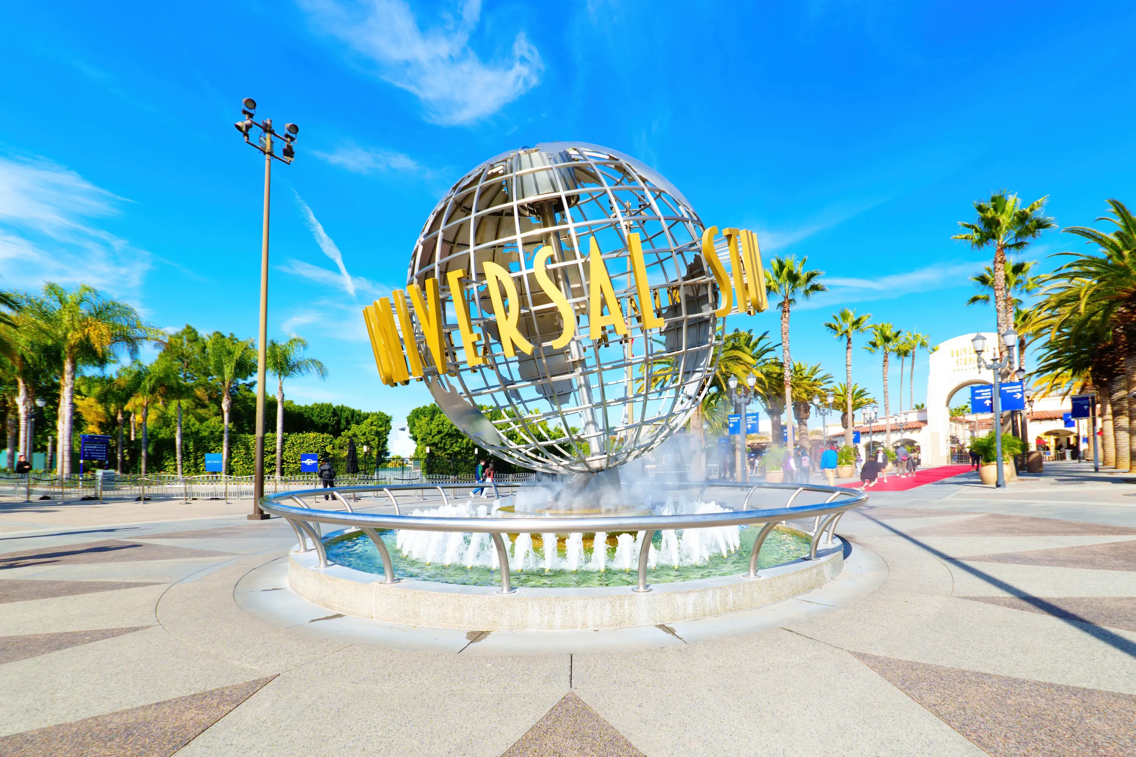 LOS ANGELES, CALIFORNIA - JANUARY 18, 2023: Iconic Universal Studios Hollywood Globe and Fountain at the Entrance to the Theme Park LOS ANGELES, CALIFORNIA - JANUARY 18, 2023: Iconic Universal Studios Hollywood Globe and Fountain at the Entrance to the Theme Park