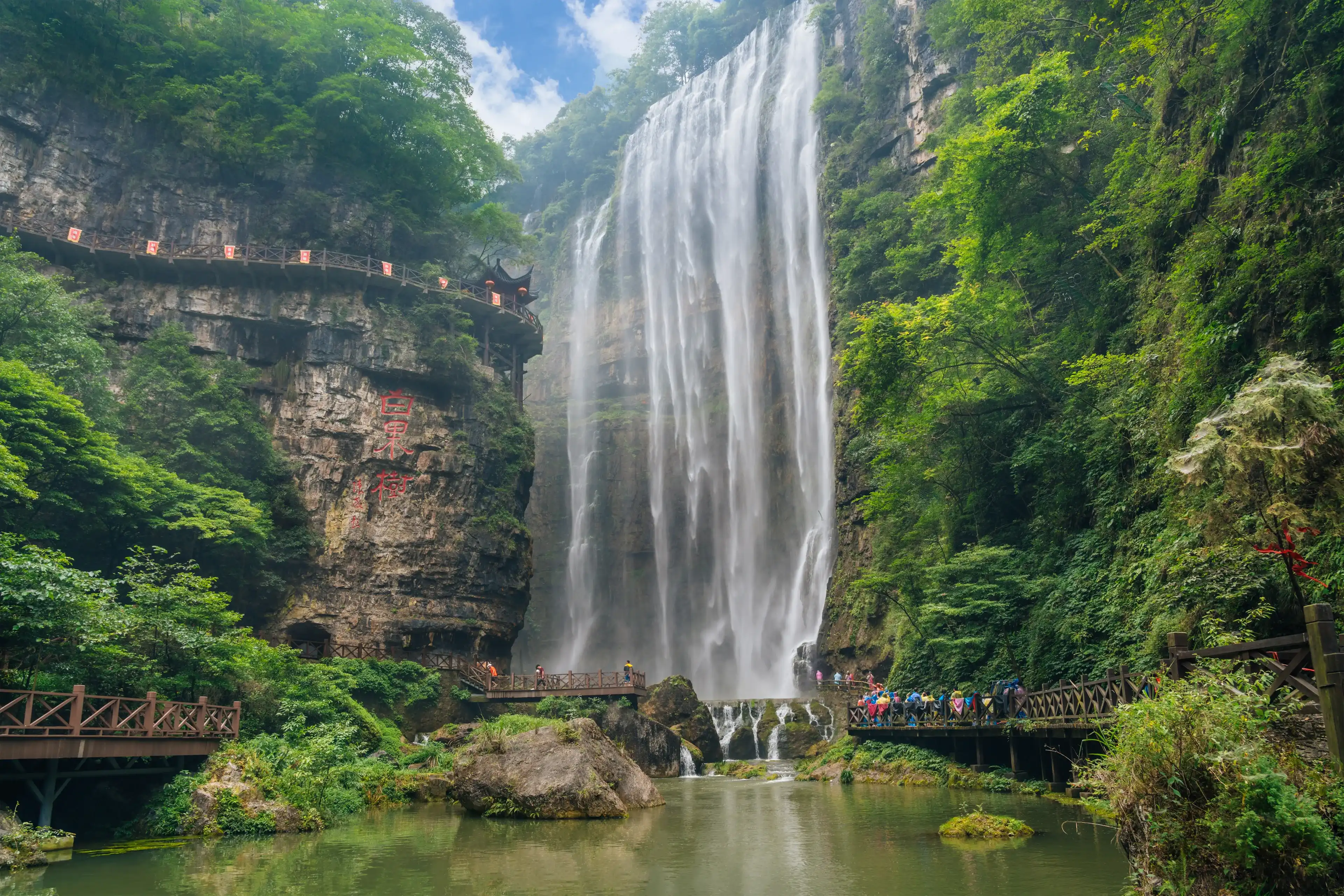 Yichang City,Hubei Province ,China.The Three Gorges waterfall is a national geopark integrating Canyon, karst cave, landscape and fossil culture..The rock is engraved with "Bai Guo Shu".