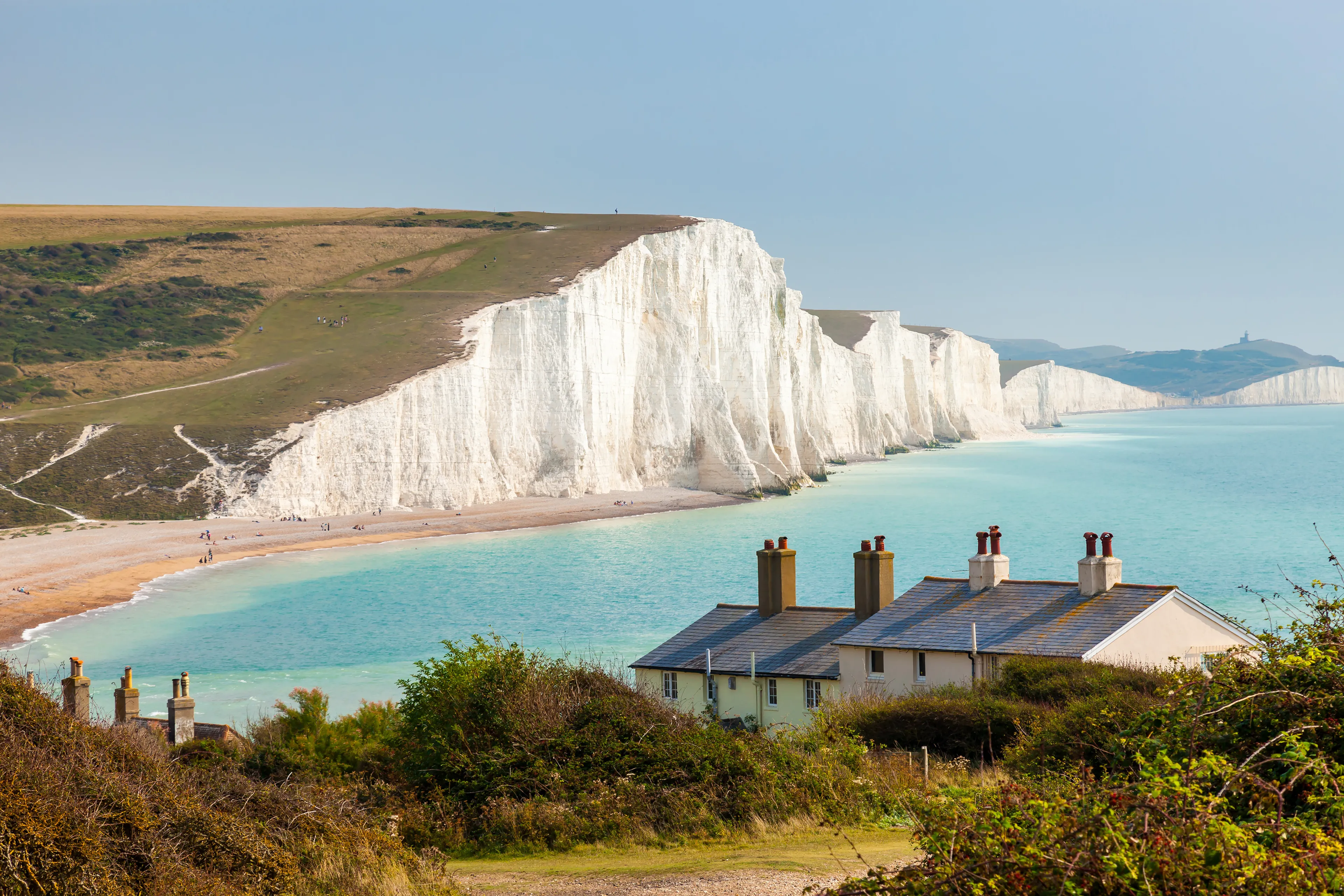 The Seven Sisters Chalk cliffs and the coastguard cottages, from Seaford Head South Downs East Sussex England UK