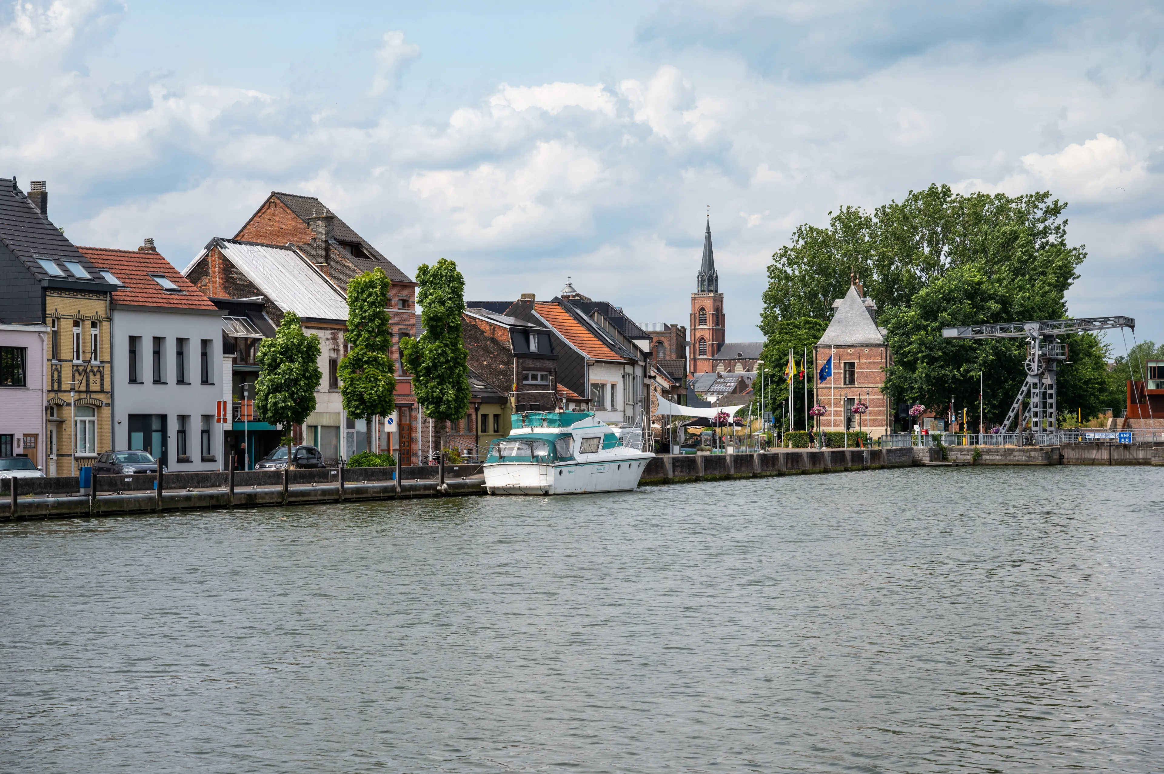 Willebroek, Antwerp Province, Belgium, June 30, 2023 - View over the village and boats at the banks of the canal