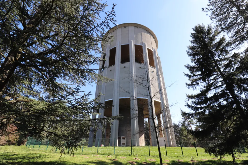Bron, France - 03 27 2021 : The Bron water tower in the Parilly park, built in 1954, city of Bron, department of Rhône, France