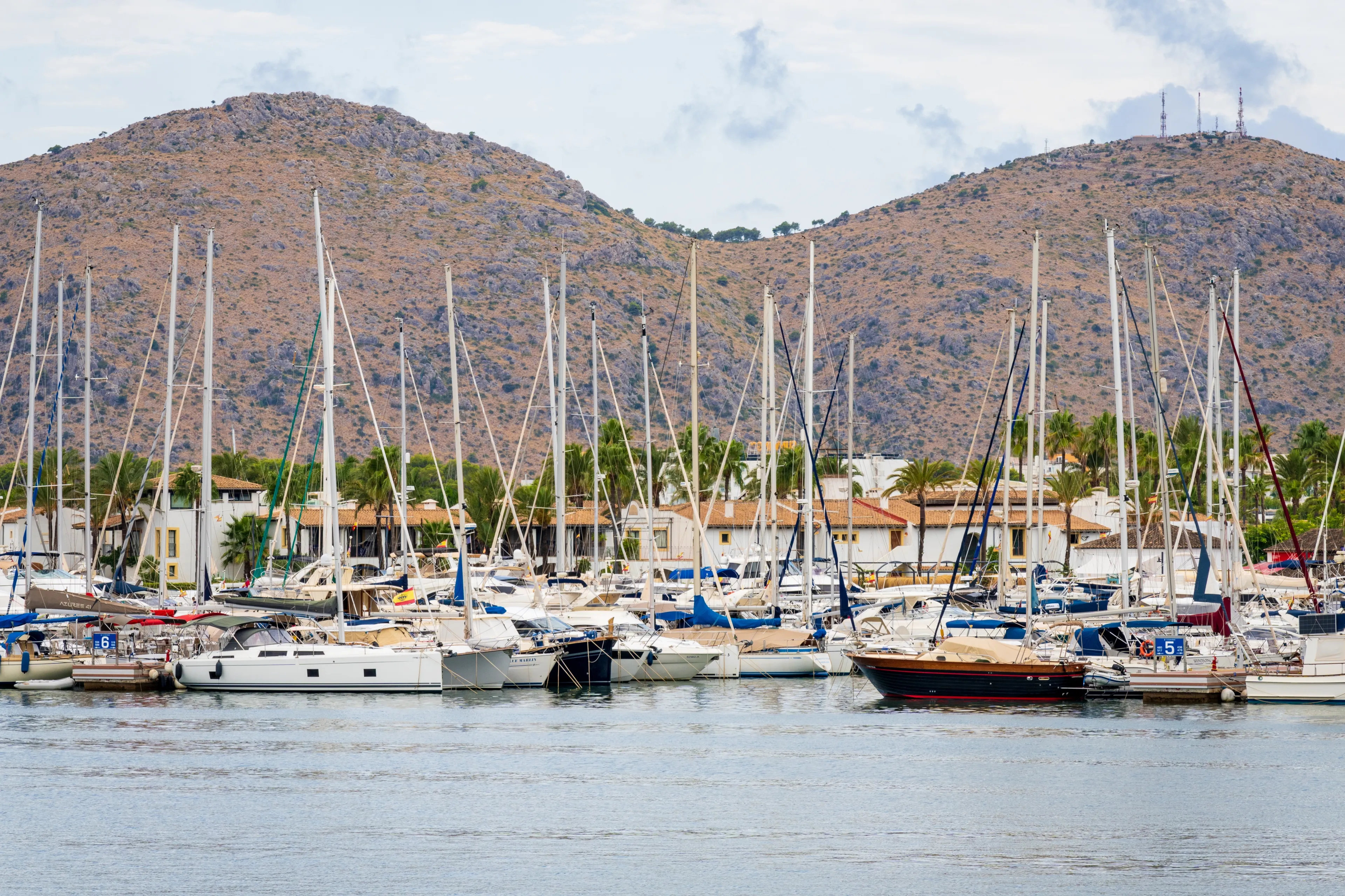 Alcudia, Spain - Aug 26, 2022: Port d’Alcúdia is a famous holiday destination on the northeast coast of Mallorca in Spain.