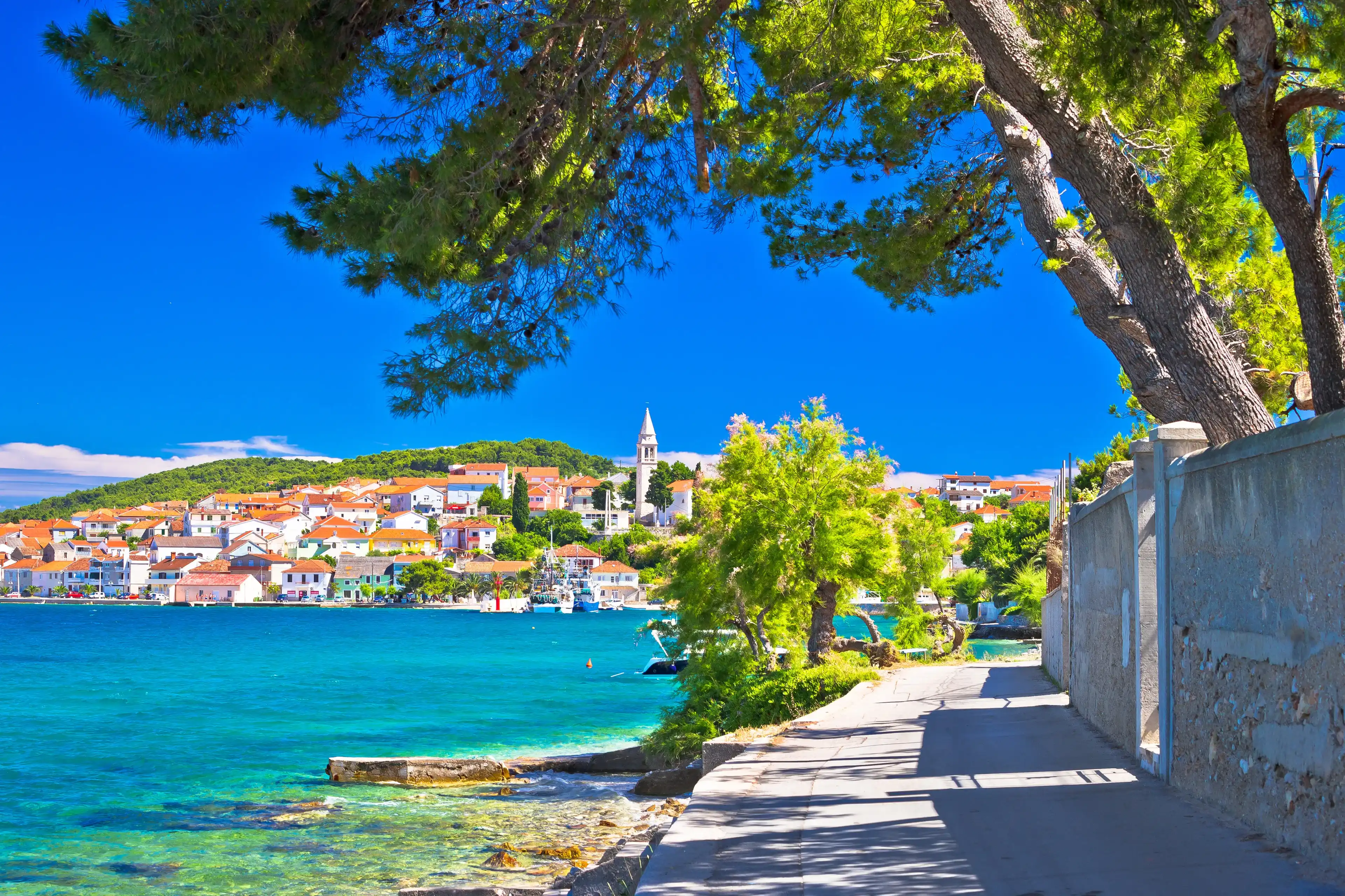 Zadar archipelago. Kali on Ugljan island turquoise sea and walkway view, Dalmatia region of Croatia 