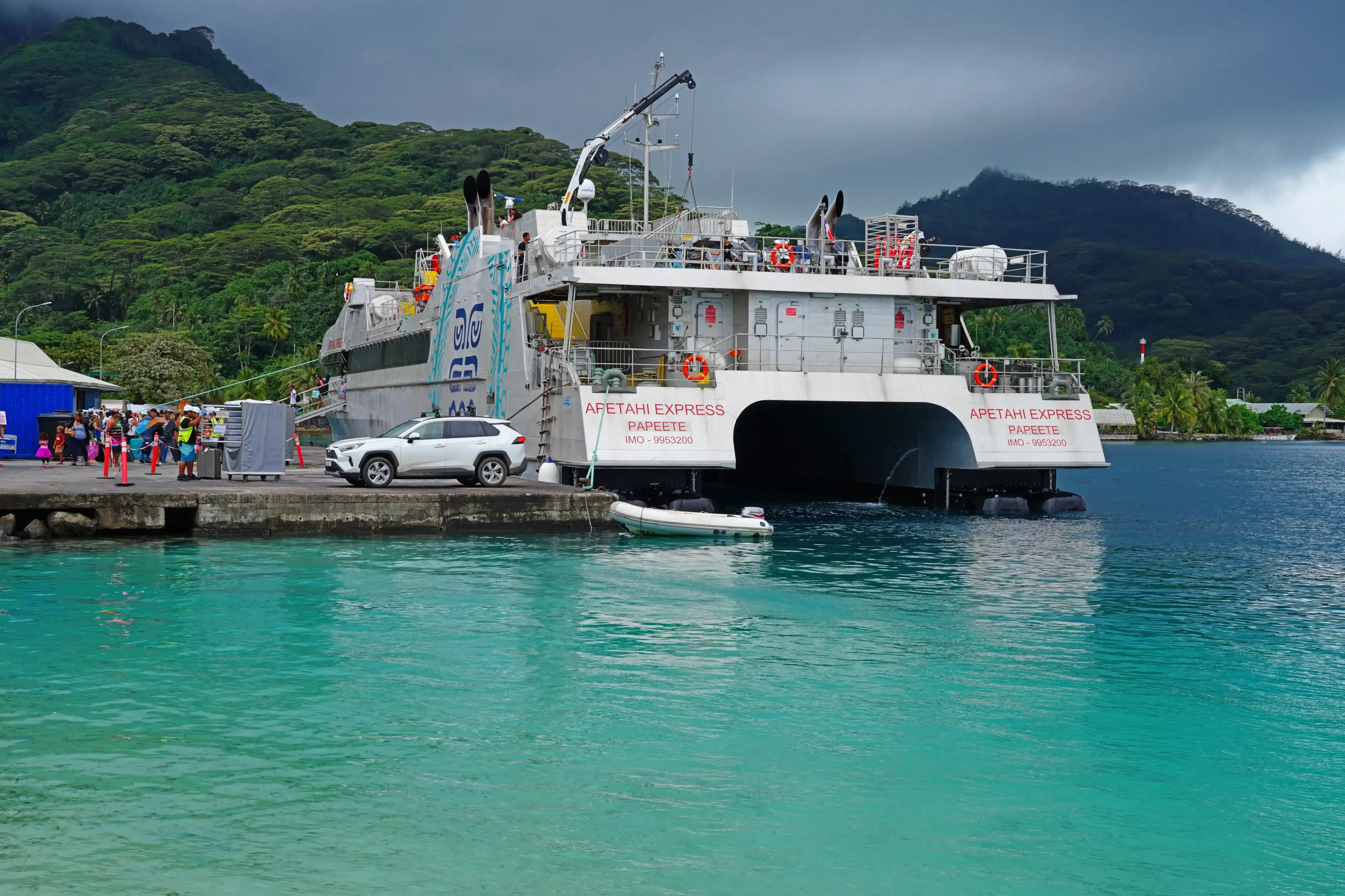 HUAHINE, FRENCH POLYNESIA – 5 DEC 2023 – View of the Apetahi Express, a ferry connecting islands in French Polynesia, in the Fare harbor, Huahine, Society Islands.