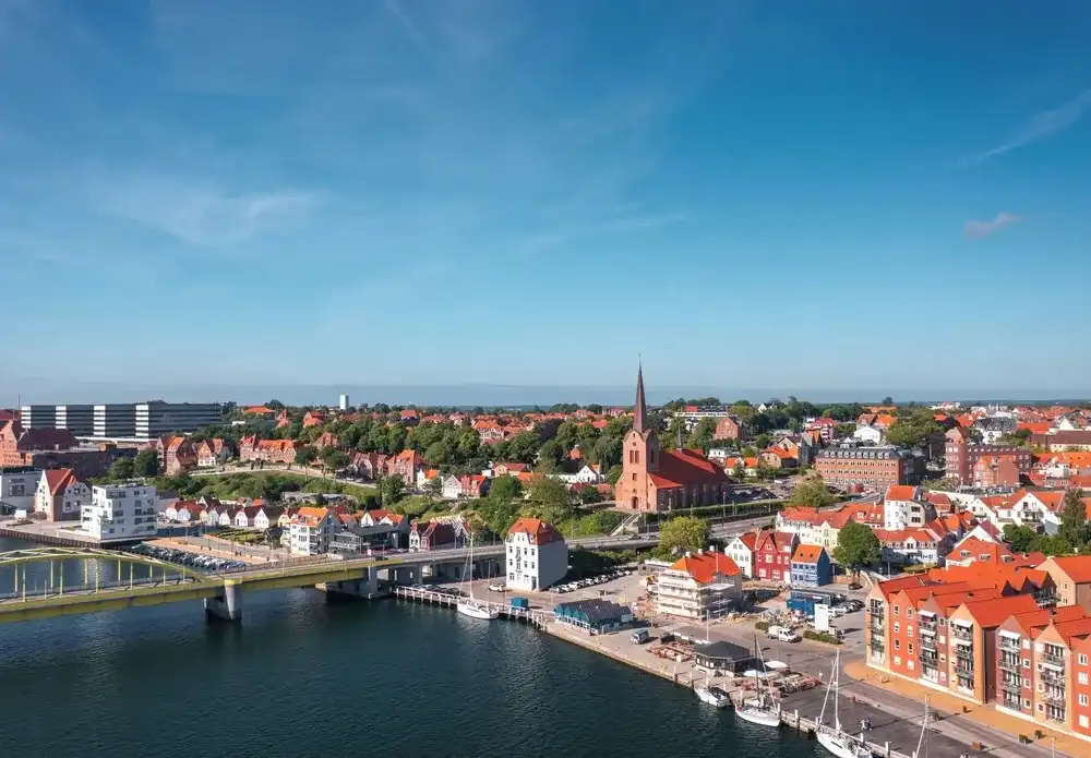 Cityscape of Sonderborg (Sønderborg, Denmark) on sunny summer day. Panoramic aerial view on the city center and castle Cityscape of Sonderborg (Sønderborg, Denmark) on sunny summer day. Panoramic aerial view on the city center and castle