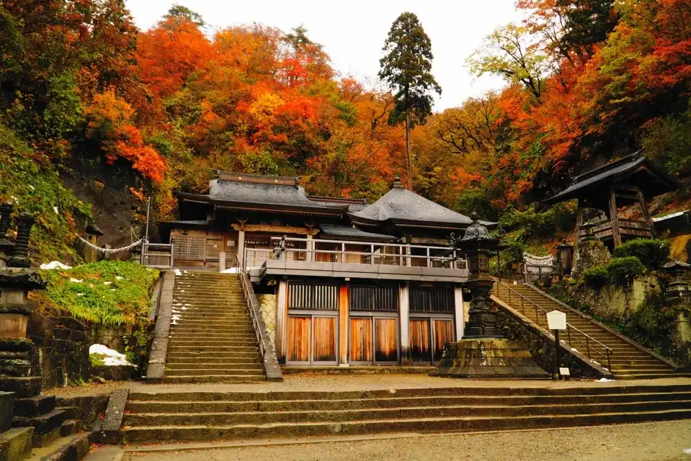 Japan, Yamagata Prefecture, Yamadera Risshakuji temple with autumn leaves